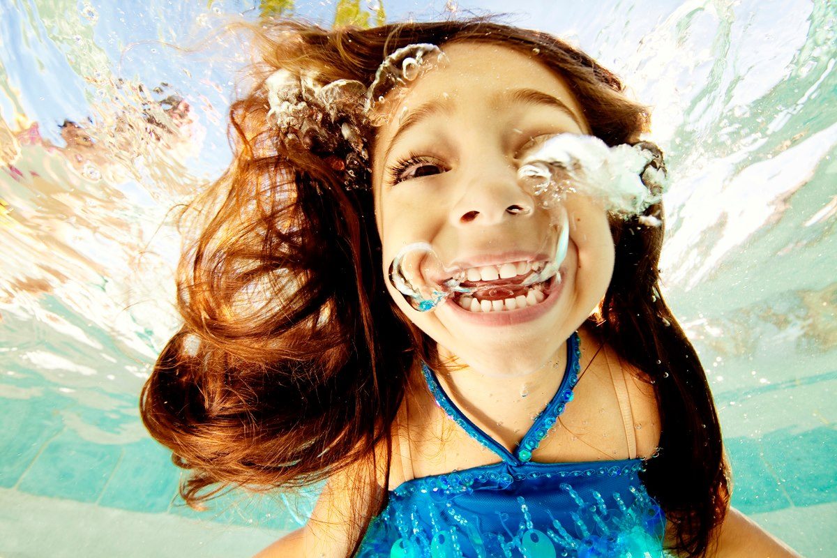 Girl, water, splash, blue. Portrait photograph by Adam Opris, finalist in the Shoot The Frame Portrait photography award, September 2012