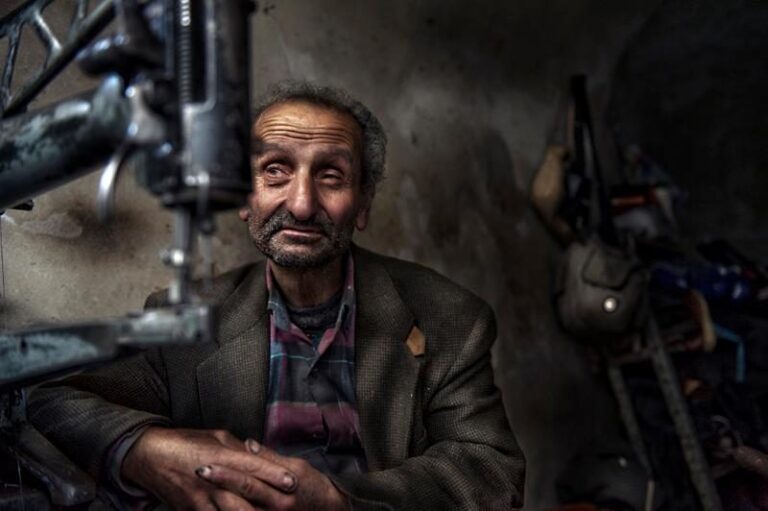 Man, old, coat, beard. Portrait photograph by Simon Krieger, finalist in the Shoot The Frame Portrait photography award, October 2012