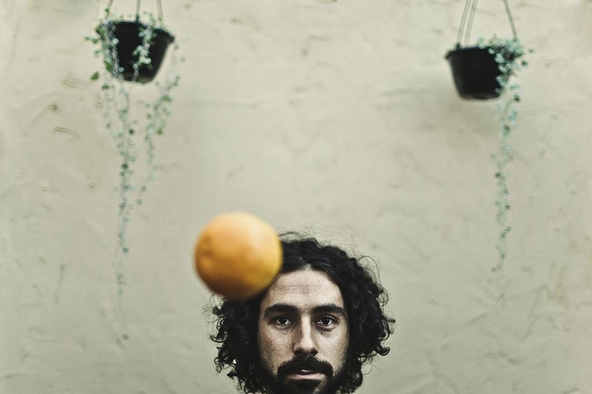 Man, orange, plot. Portrait photograph by Oli Sansom, winner of the Shoot The Frame Portrait photography award, November 2012