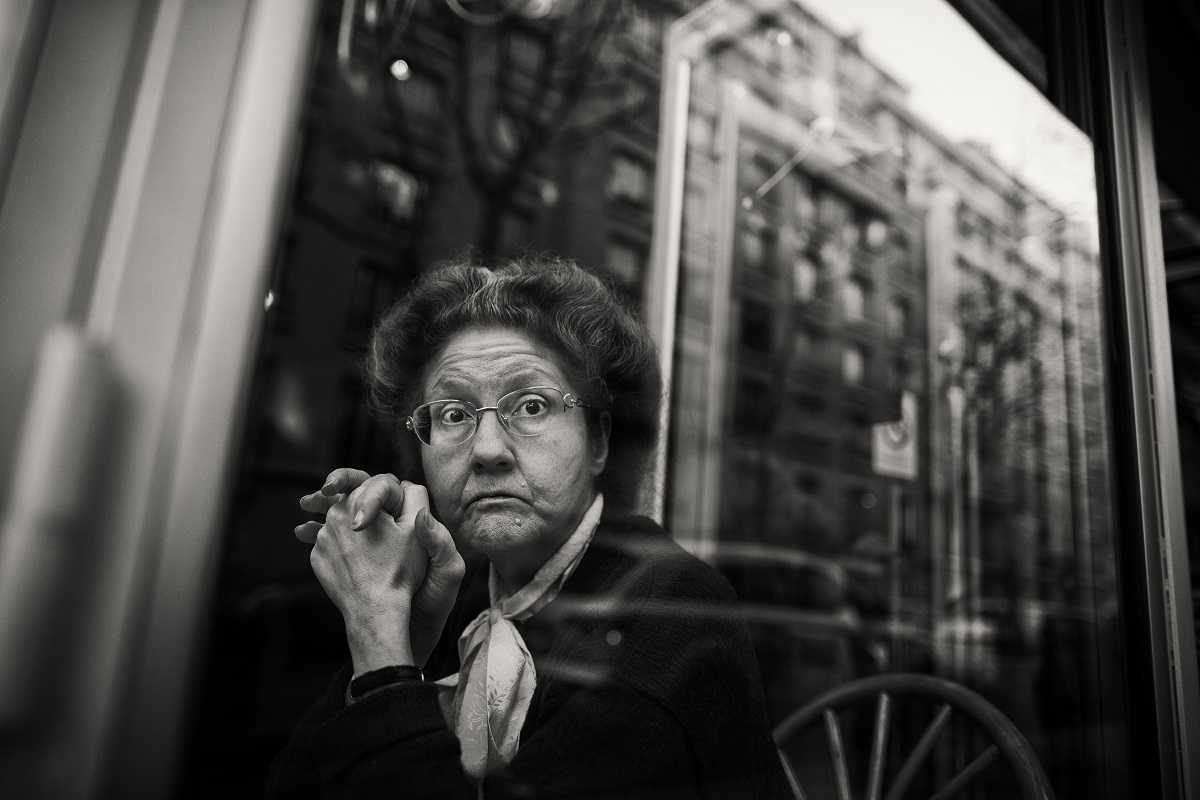 Wman, old, glasses, sitting. Portrait photograph by Christophe Debon, finalist in the Shoot The Frame Portrait photography award, June 2013