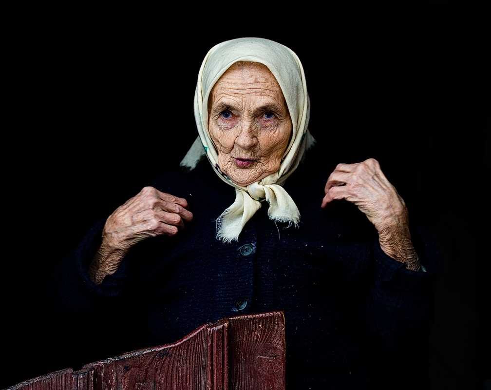 Woman, old, coat. Portrait photograph by Claudiu Guraliuc, finalist in the Shoot The Frame Portrait photography award, August 2013