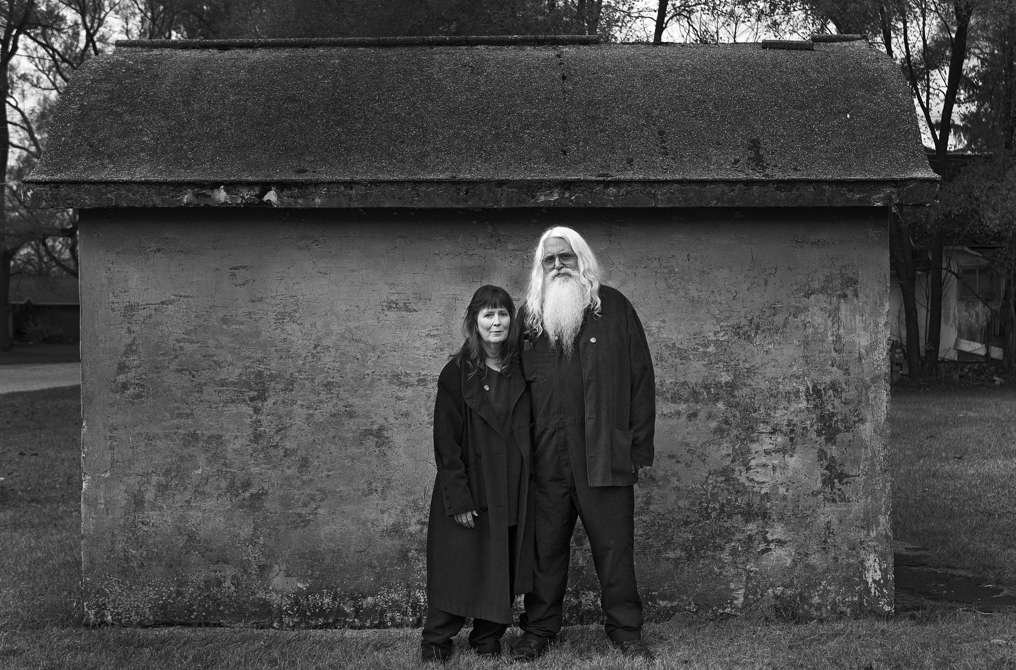 Man, woman, beard, house. Portrait photograph by Neil Barris, finalist in the Shoot The Frame Portrait photography award, November 2013