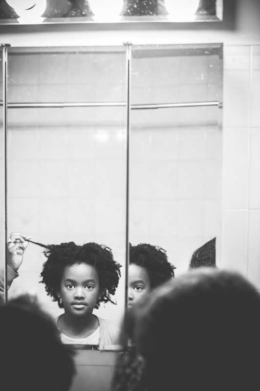 Gitl, curly, mirror. Portrait photograph by Vikki Sloviter, finalist in the Shoot The Frame Portrait photography award, January 2014