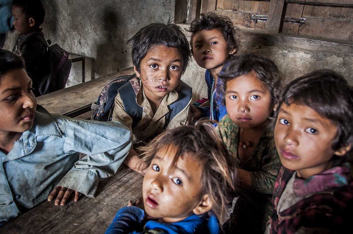 Children, table, staring. Portrait photograph by Susan Webster, finalist in the Shoot The Frame Portrait photography award, June 2014