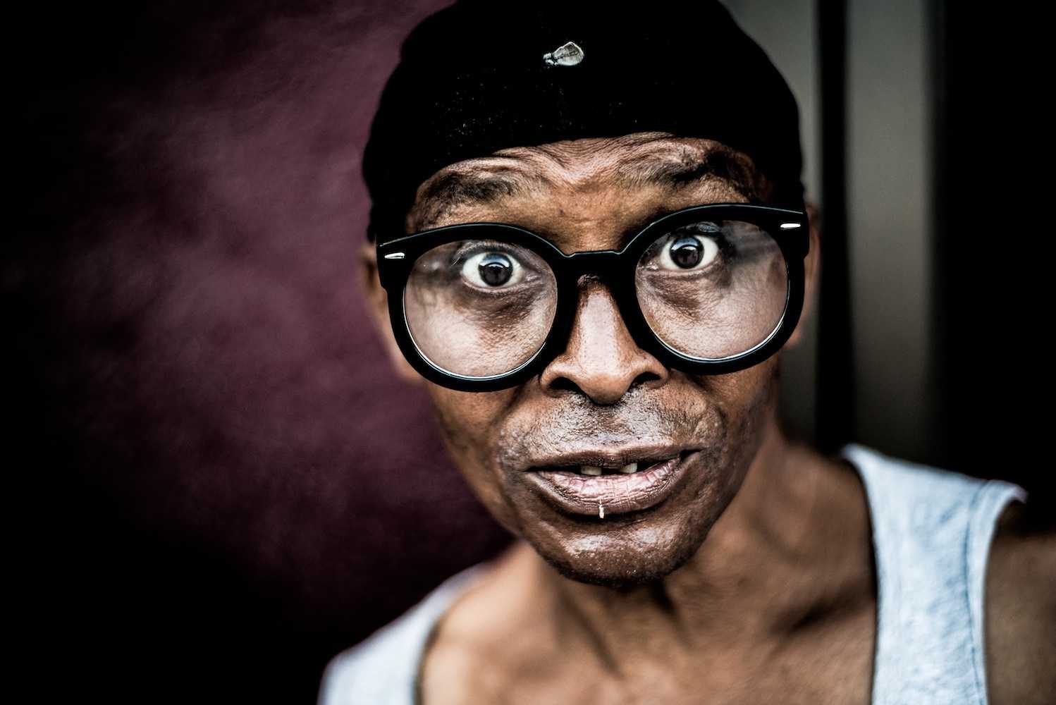 Man, galsses, eyes, stare. Portrait photograph by Hugo Hentoff, winner of the Shoot The Frame Portrait photography award, June 2014
