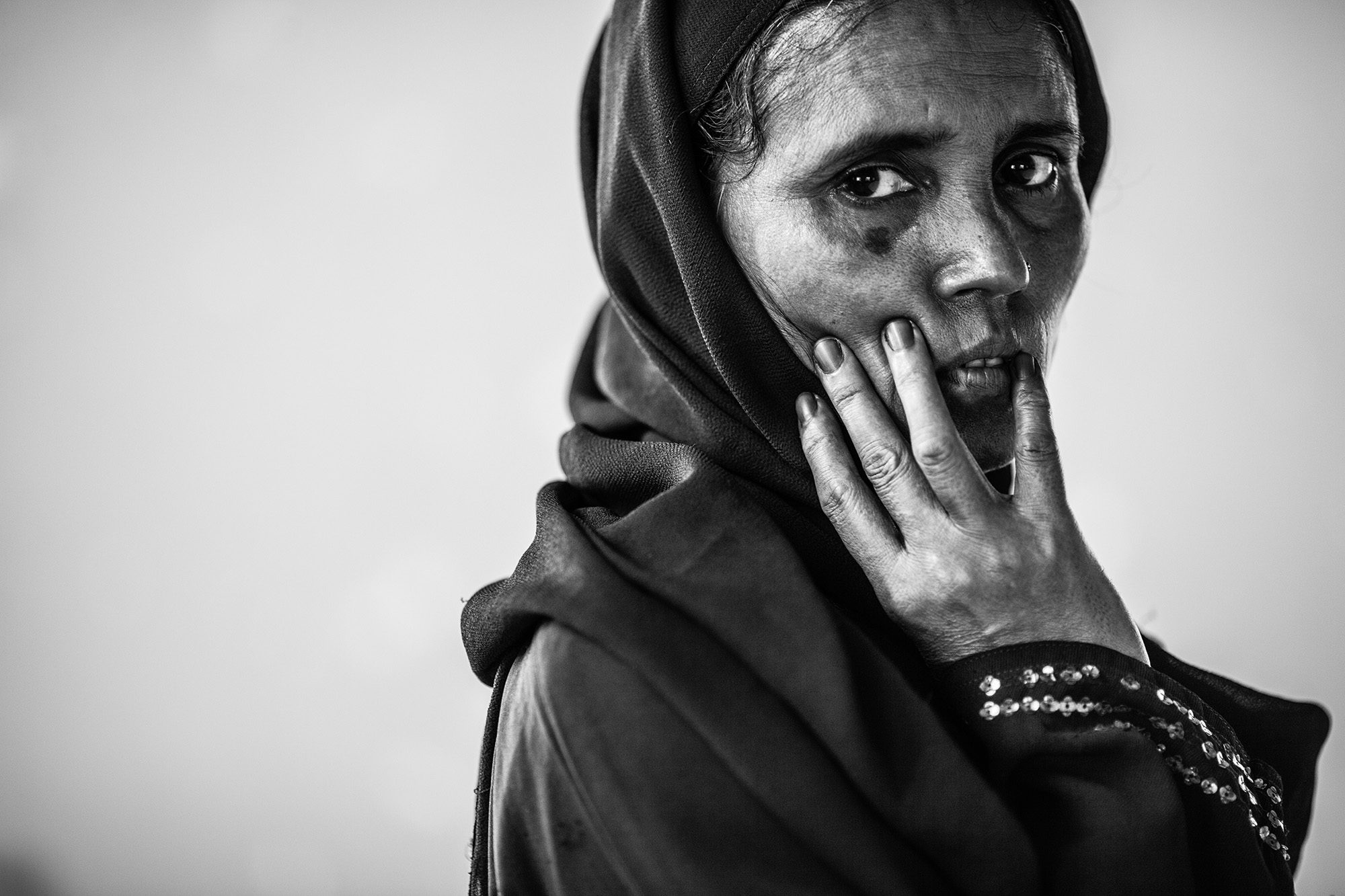 Woman, black, side. Portrait photograph by Marcin Zaborowski, finalist in the Shoot The Frame Portrait photography award, August 2014