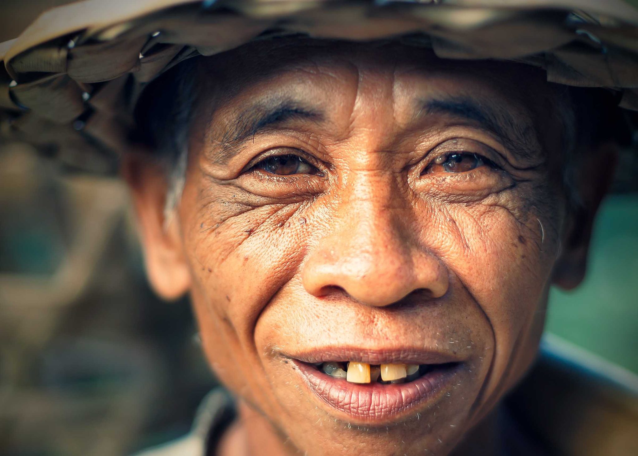 Man, teeth, smile, hat. Portrait photograph by Manu Hume, finalist in the Shoot The Frame Portrait photography award, November 2014
