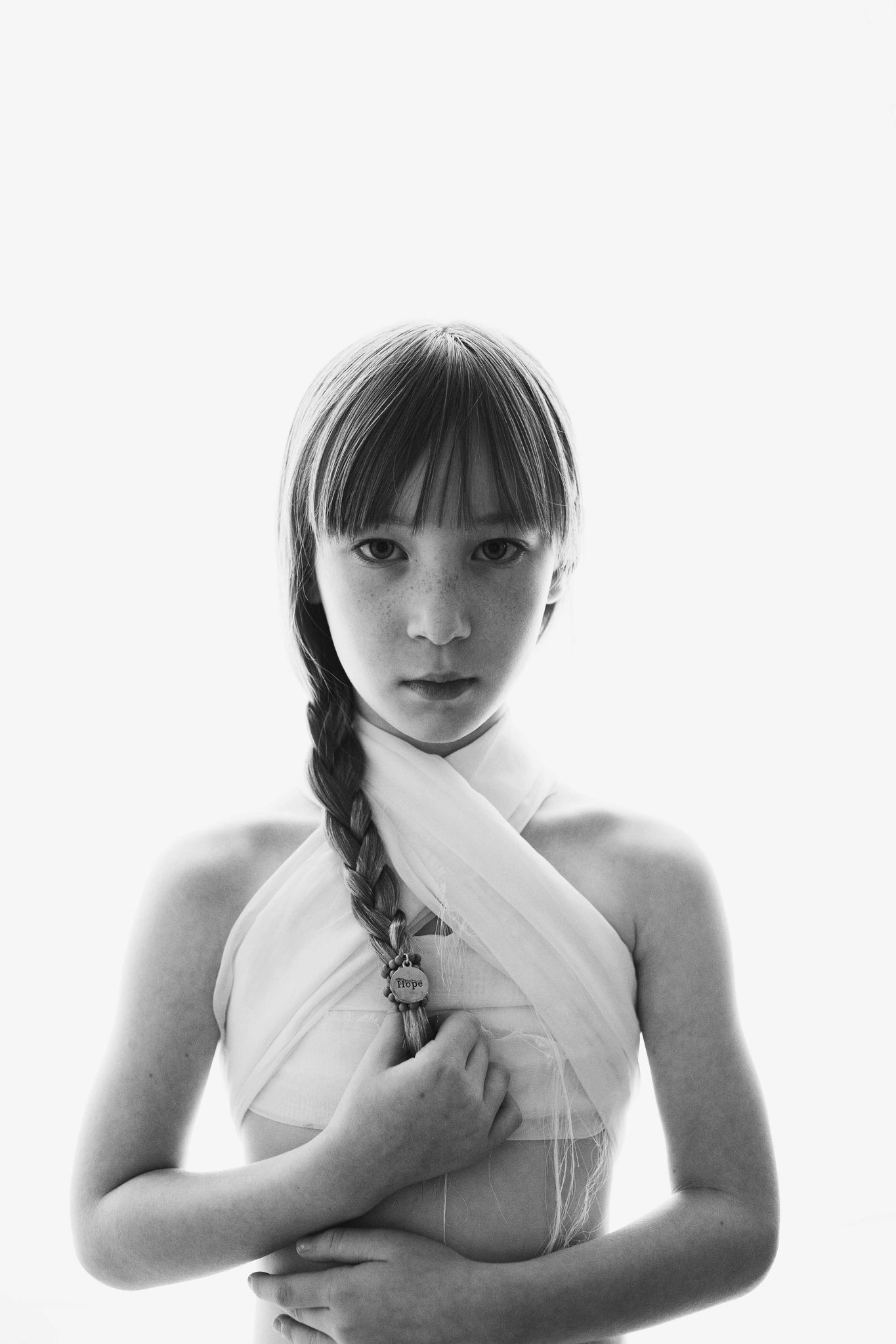 Girl, braided, white. Portrait photograph by Kristy Winter, winner of the Shoot The Frame Portrait photography award, November 2014