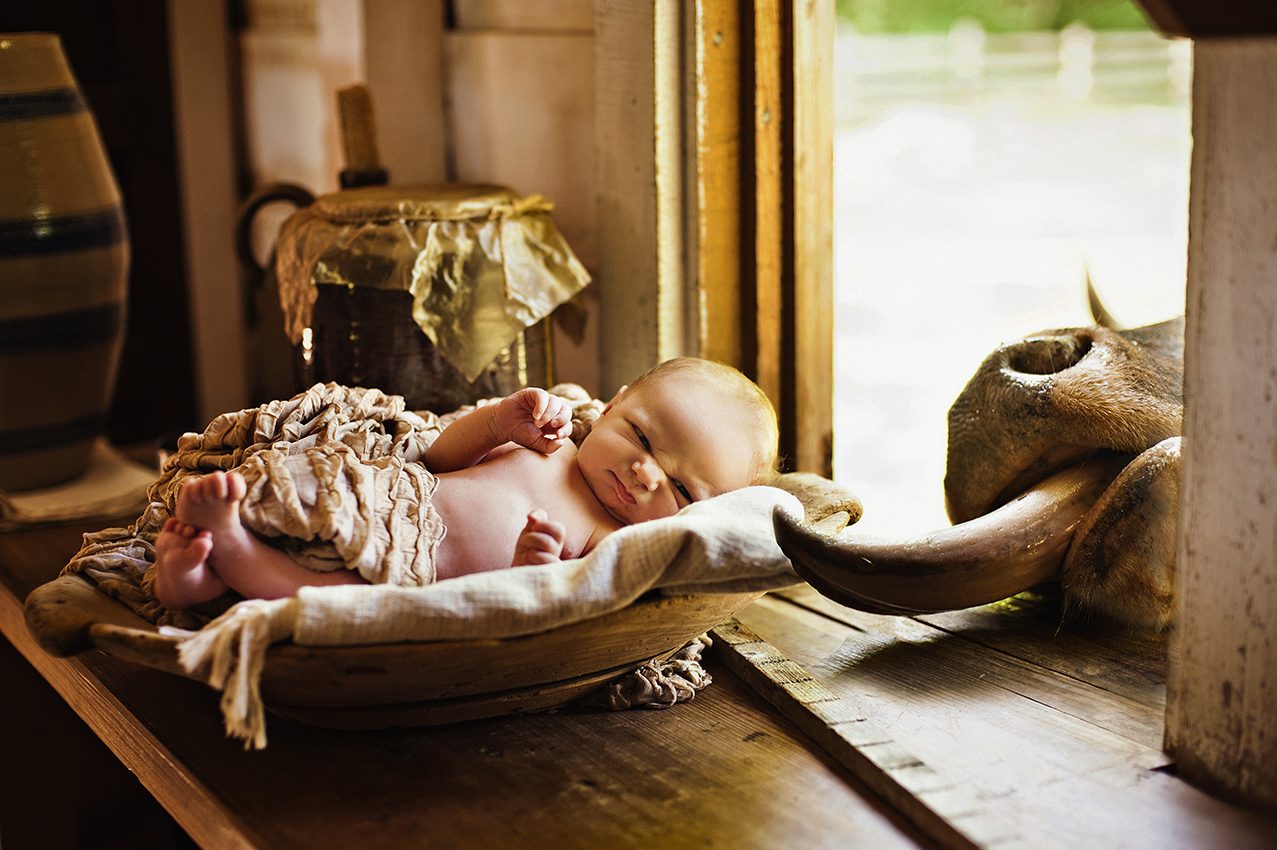 Baby, cradle, infant. Portrait photograph by Brooke Mayo, finalist in the Shoot The Frame Portrait photography award, March 2015