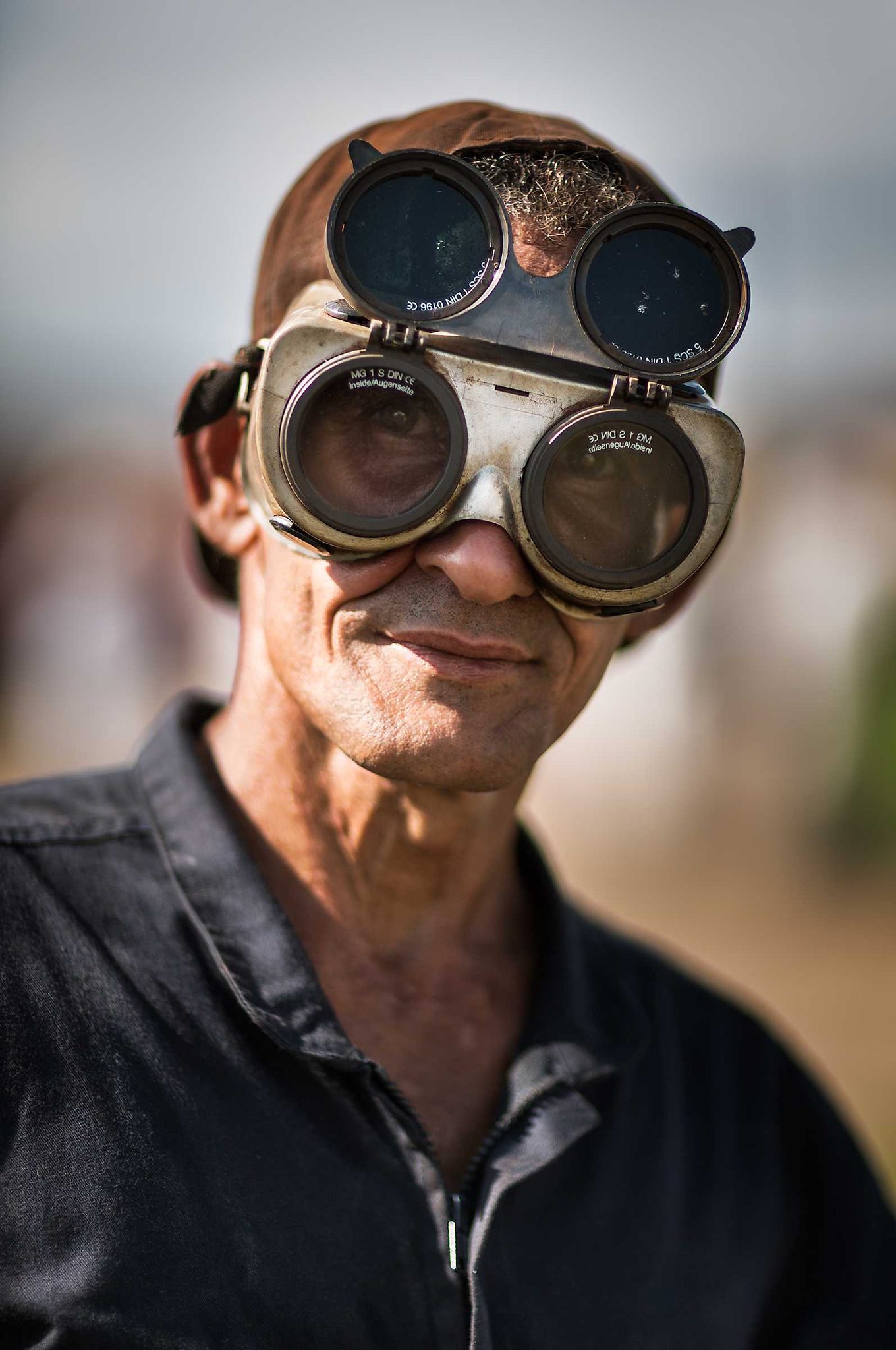 Man, glass, mask. Portrait photograph by Nicolás Biglié, finalist in the Shoot The Frame Portrait photography award, May 2015