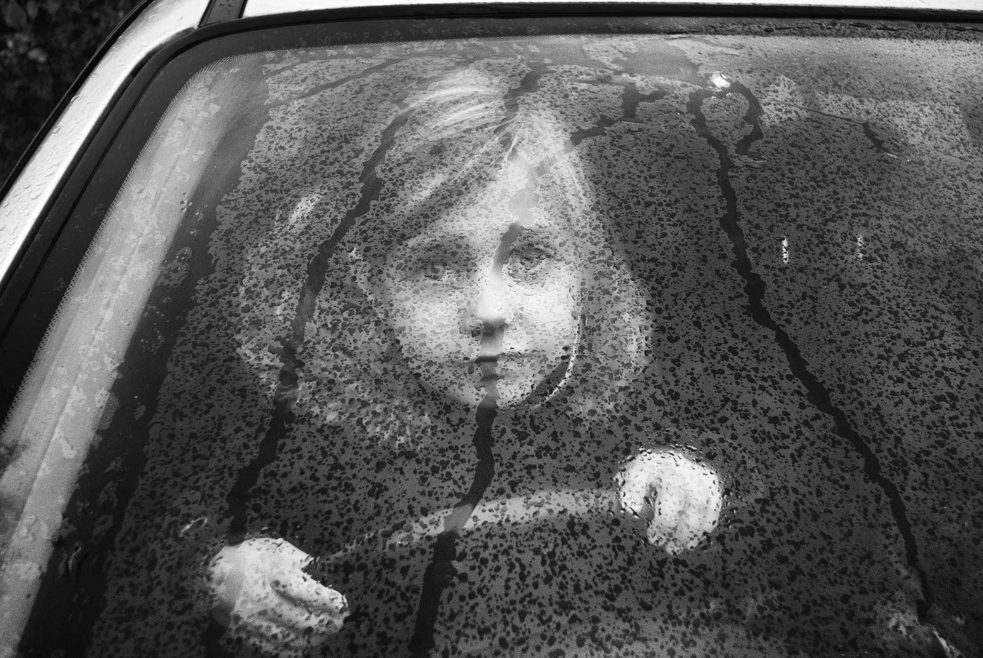 Gitl, drops, water, blurry. Portrait photograph by Adrian Shaw, finalist in the Shoot The Frame Portrait photography award, July 2015