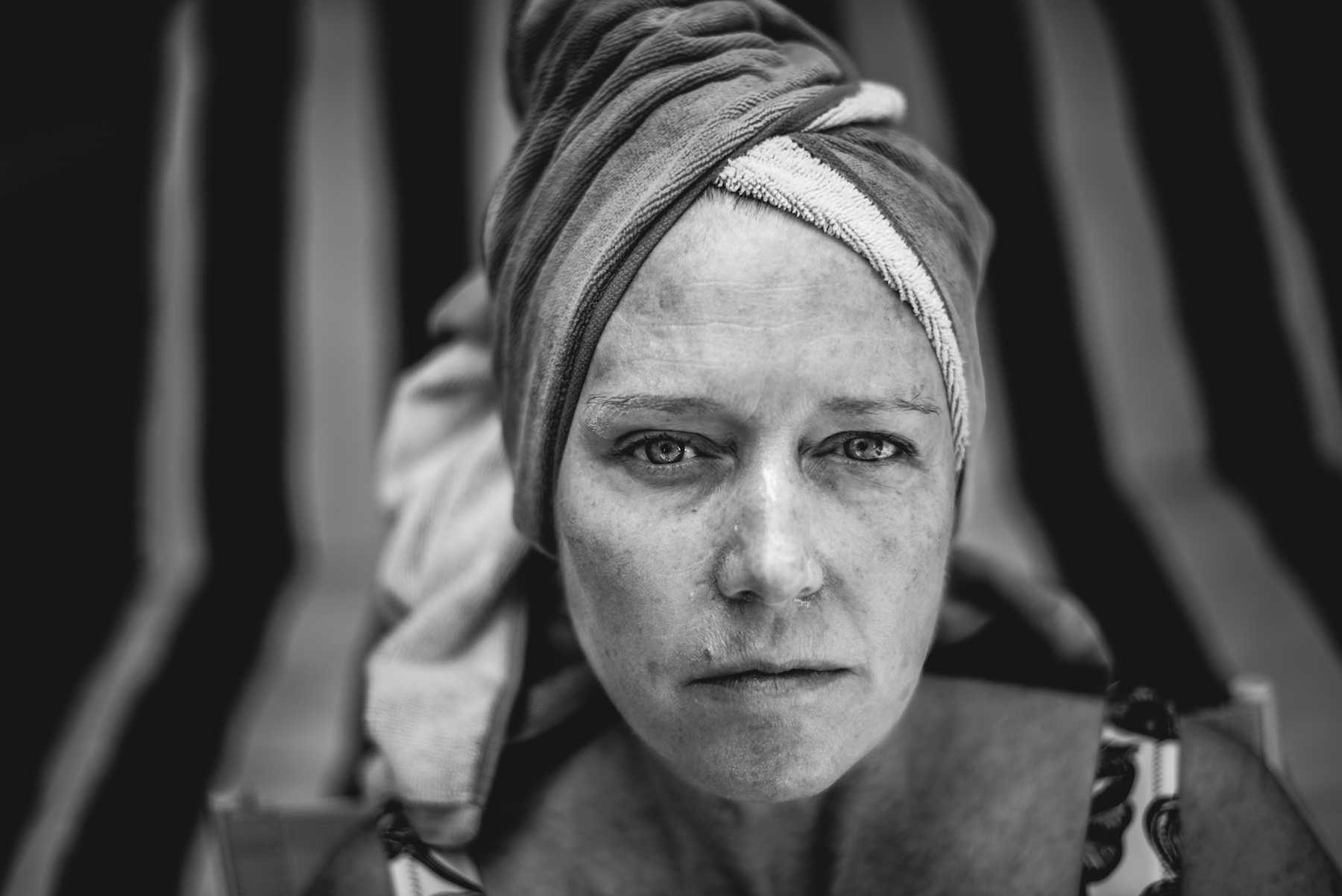 Woman, hood, face. Portrait photograph by Hugo Hentoff, finalist in the Shoot The Frame Portrait photography award, July 2015