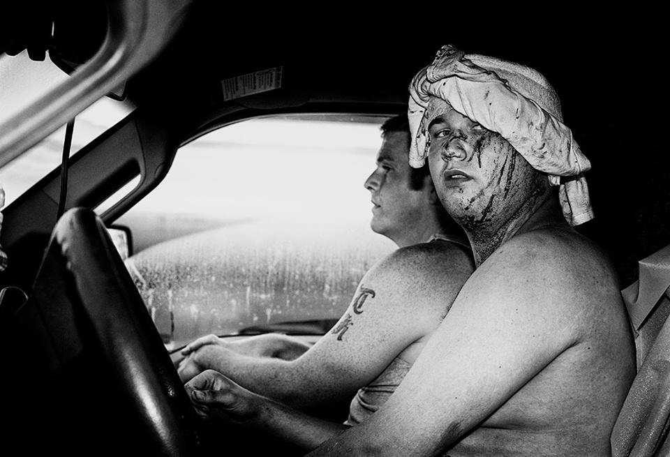 Men, bare, wheels, car. Portrait photograph by Jon Luvelli, finalist in the Shoot The Frame Portrait photography award, July 2015