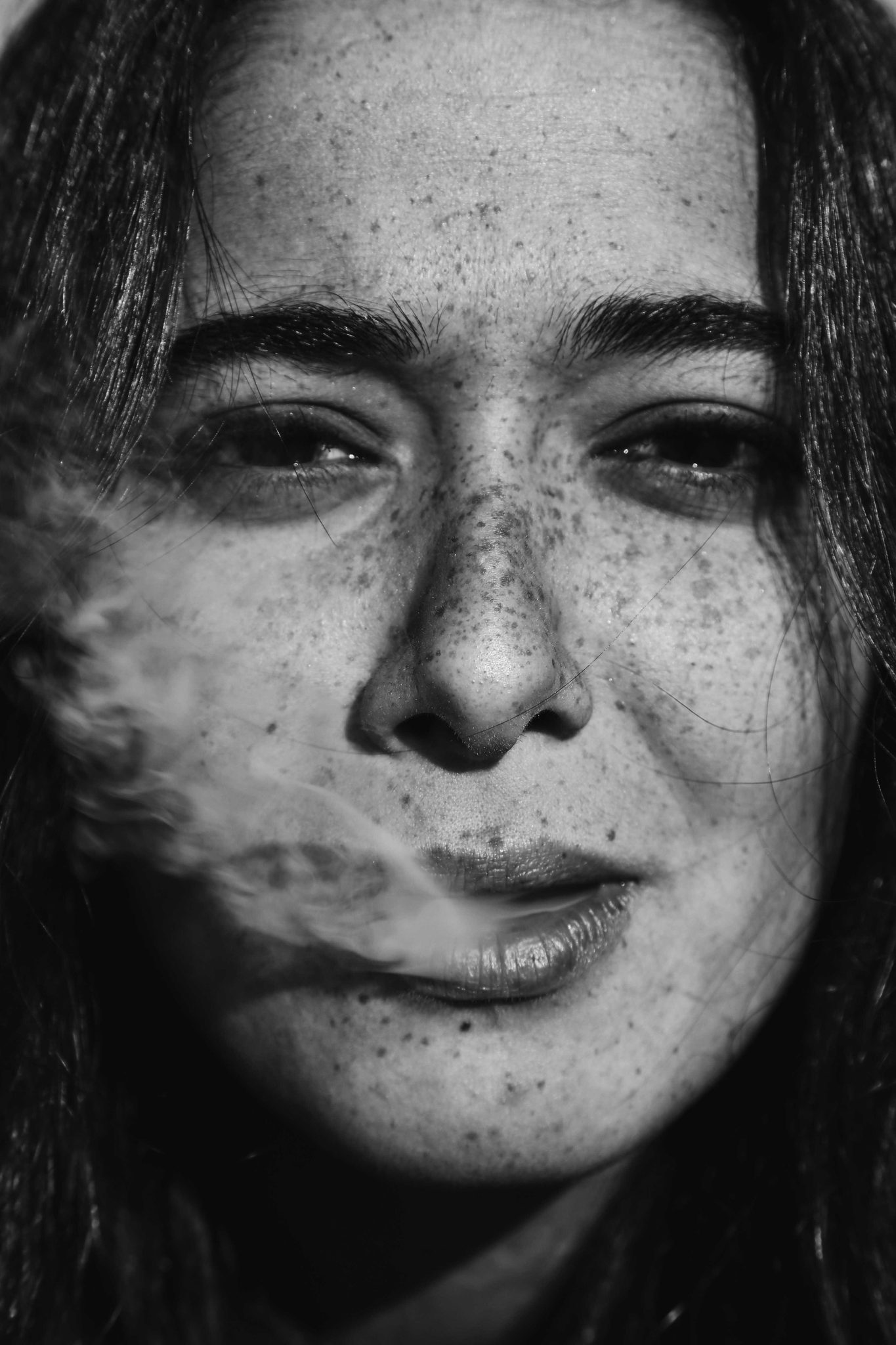 Woman, precklse, smoke. Portrait photograph by Asli Sungur, finalist in the Shoot The Frame Portrait photography award, November 2015