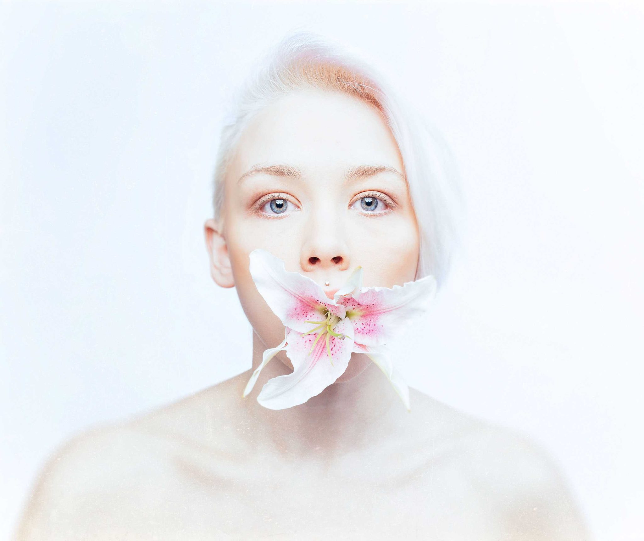 Woman, orchid, mouth. Portrait photograph by Ian Pettigrew, finalist in the Shoot The Frame Portrait photography award, January 2016