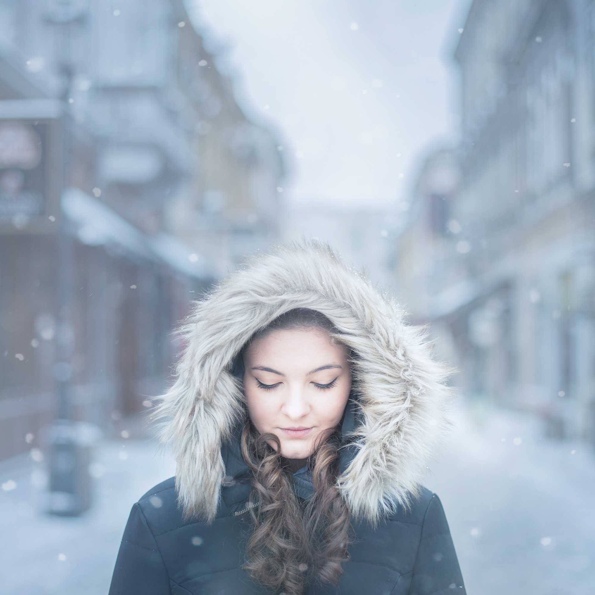 Woman, snow, coat. Portrait photograph by Luiza Marinas, finalist in the Shoot The Frame Portrait photography award, January 2016