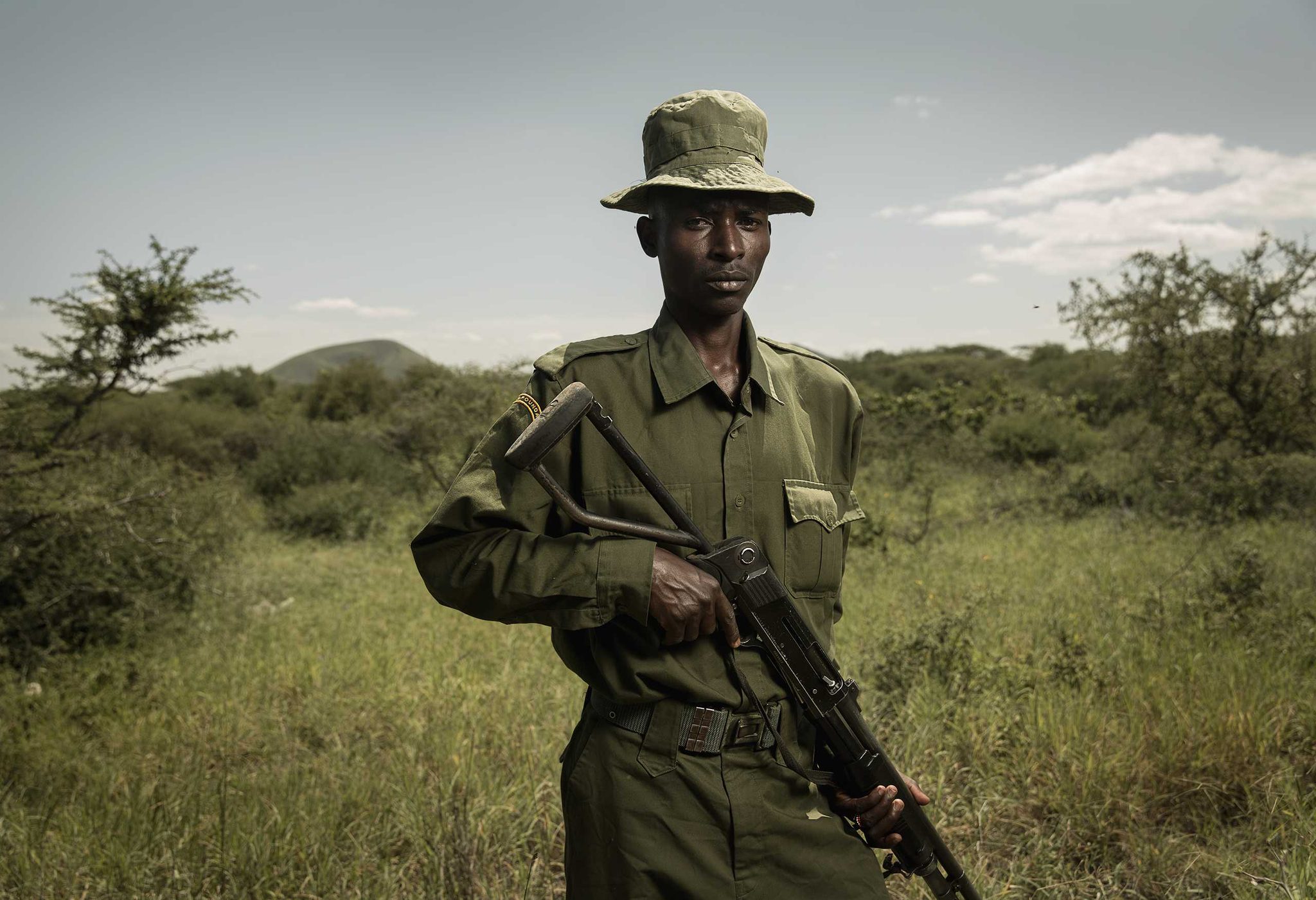 Man, hat, gun. Portrait photograph by Tierney Farrell, finalist in the Shoot The Frame Portrait photography award, January 2016