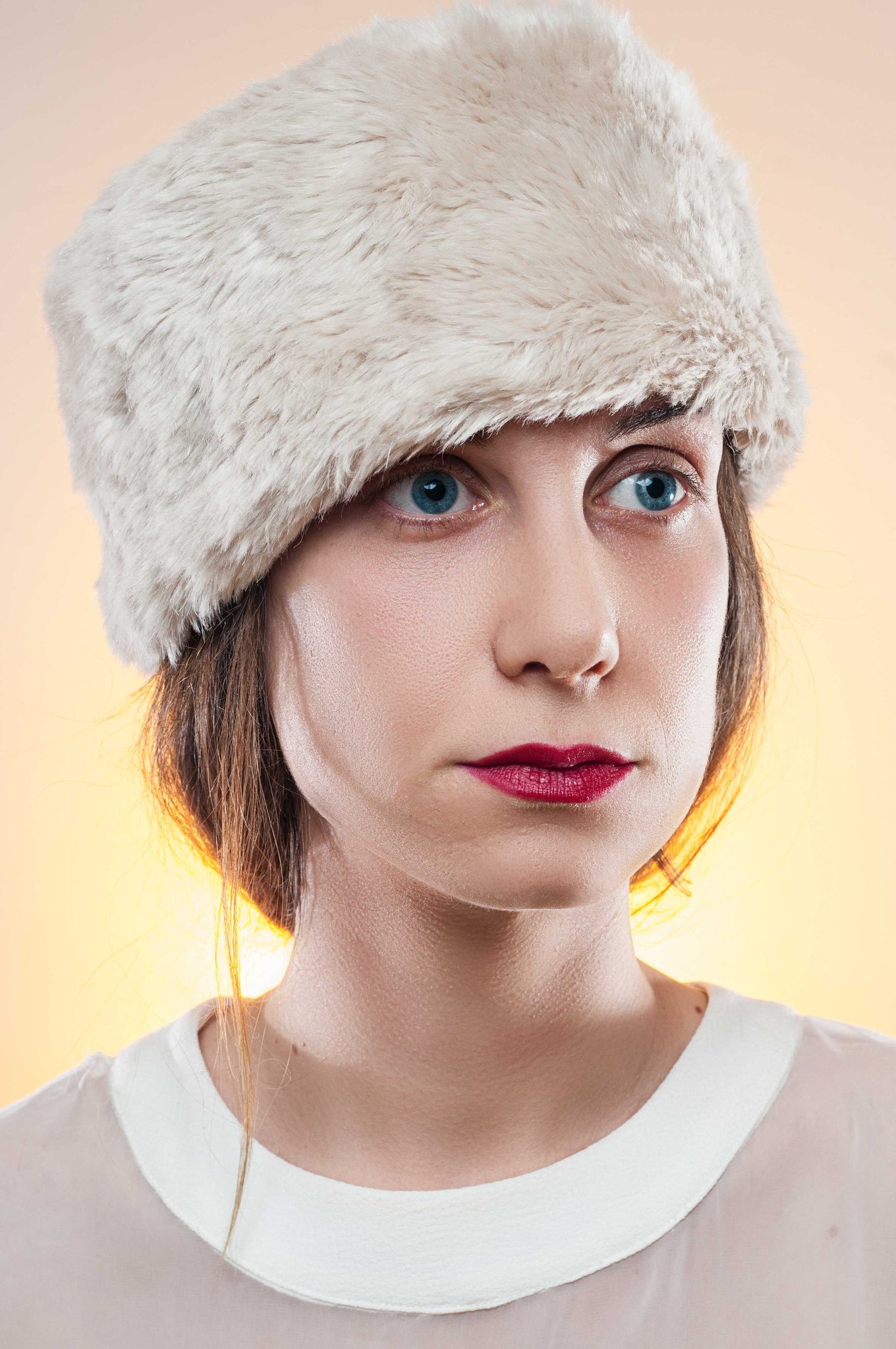 Woman, cap, white. Portrait photograph by Mehmet Baran Erdoğan, finalist in the Shoot The Frame Portrait photography award, February 2016
