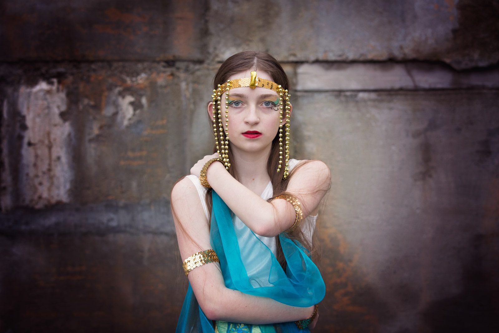 Lady, costume, wall. Portrait photograph by Chelsea Morgan, finalist in the Shoot The Frame Portrait photography award, June 2016