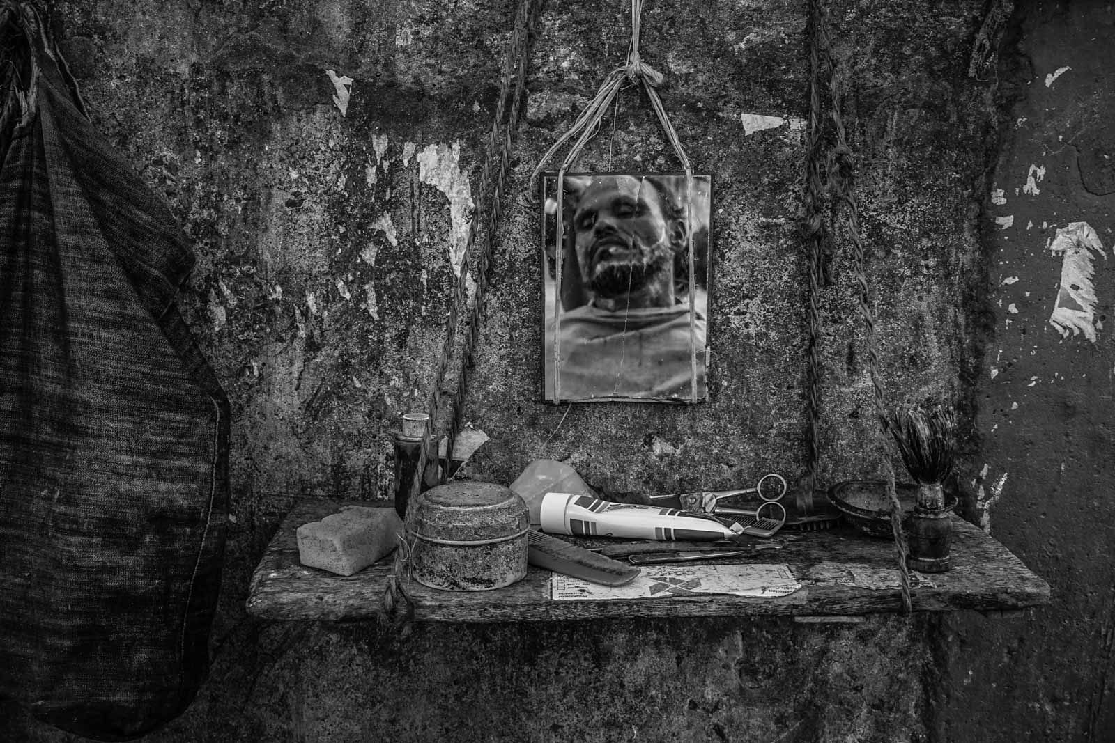 Mirror, rock, beard, scissors. Portrait photograph by Saud Faisal, finalist in the Shoot The Frame Portrait photography award, July 2016