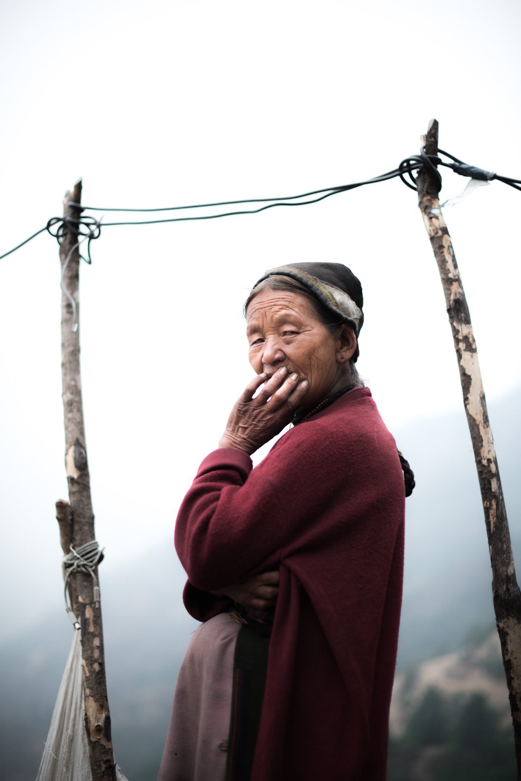 Woman, old, standing. Portrait photograph by Benedict Grey, finalist in the Shoot The Frame Portrait photography award, August 2016