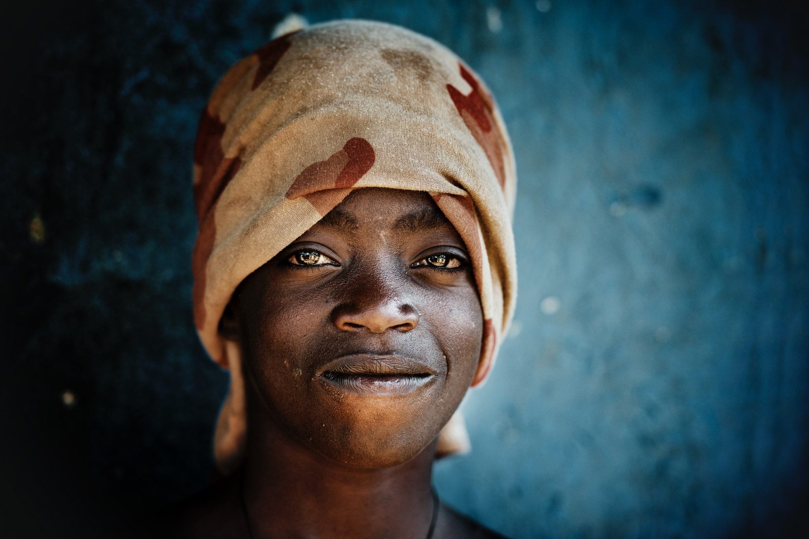 Black, woman, bandana/kerchief, happy. Portrait photograph by Trevor Cole, finalist in the Shoot The Frame Portrait photography award, November 2016
