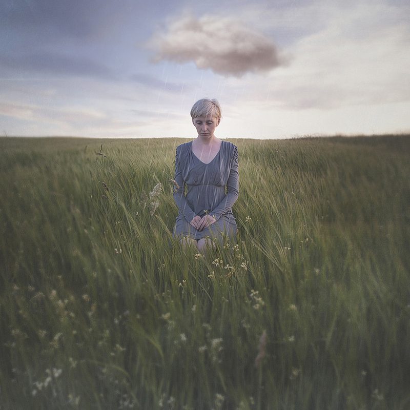 Woman, grass, filed. Portrait photograph by Anca Magurean, finalist in the Shoot The Frame Portrait photography award, March 2017
