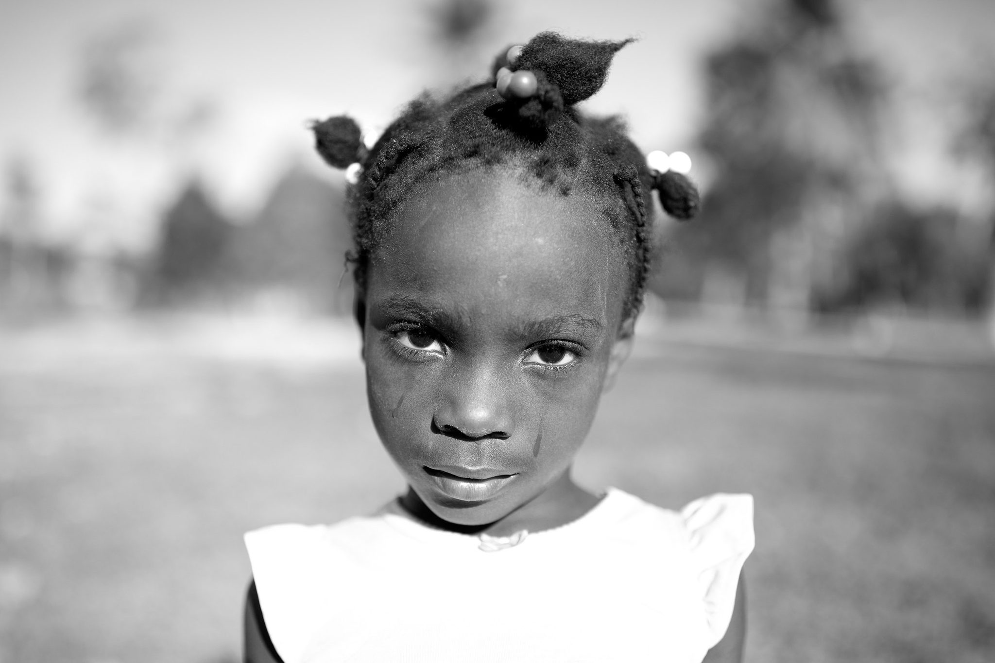 Girl, child, black, curly. Portrait photograph by Vincent Karcher, finalist in the Shoot The Frame Portrait photography award, April 2017