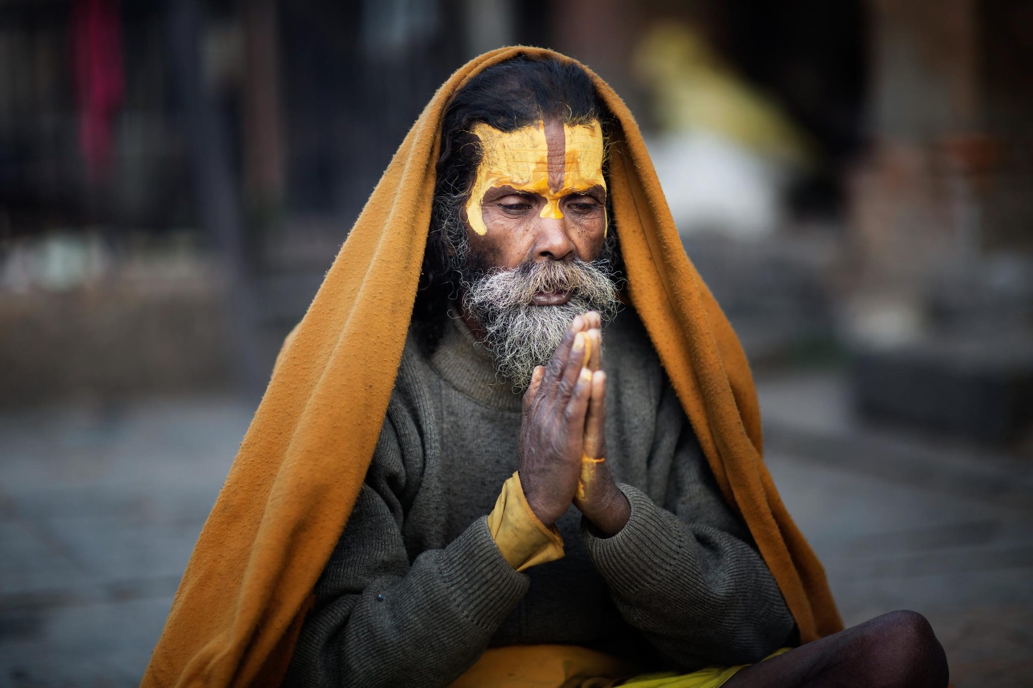Man, praying, old. Portrait photograph by Yaxin Ren, finalist in the Shoot The Frame Portrait photography award, April 2017