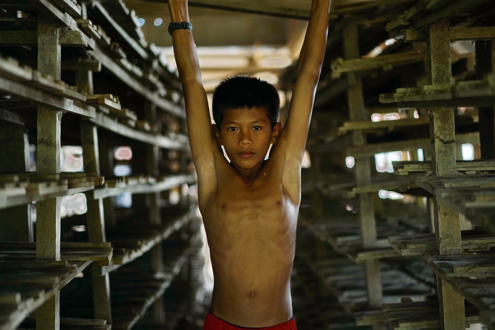 Boy, body, hands up. Portrait photograph by Arik S. Mintorogo, finalist in the Shoot The Frame Portrait photography award, May 2017