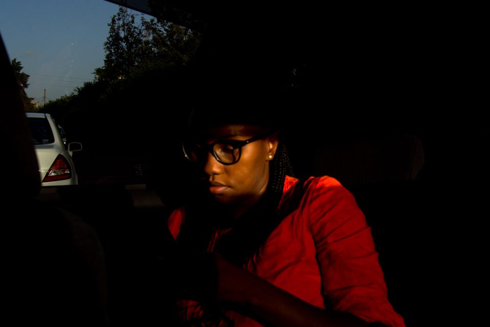Woman, red, glasses, face. Portrait photograph by Sean Power, finalist in the Shoot The Frame Portrait photography award, June 2017