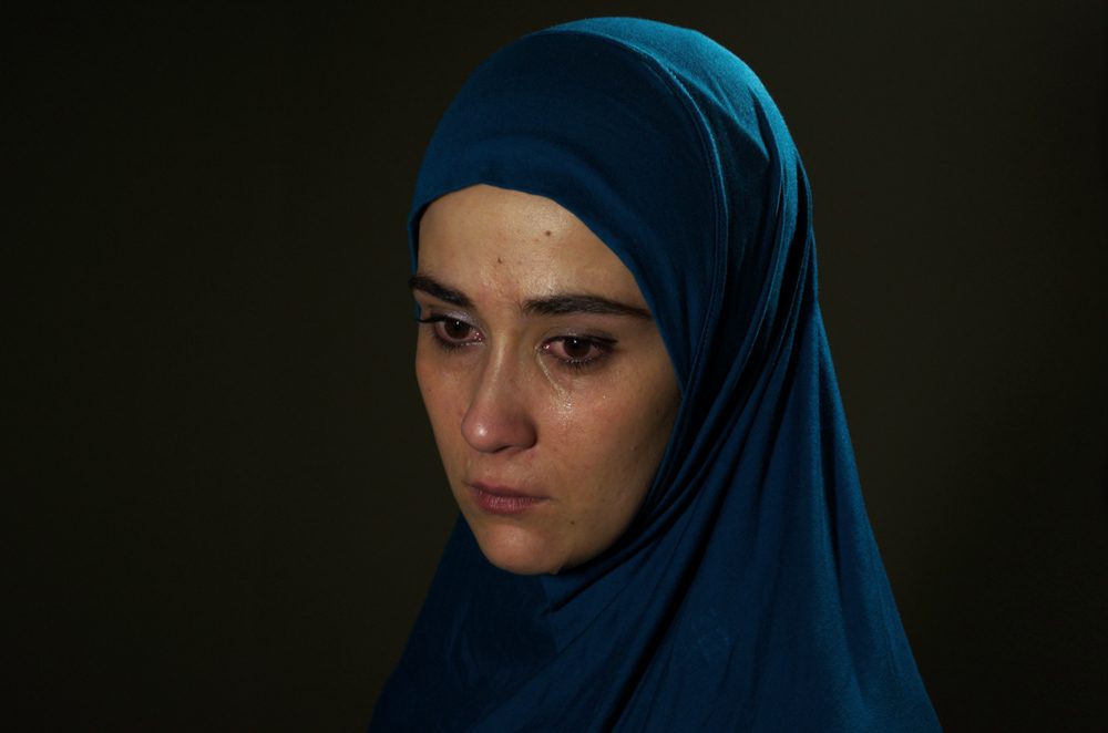 Muslim, woman, crying. Portrait photograph by Don Raça, finalist in the Shoot The Frame Portrait photography award, December 2017