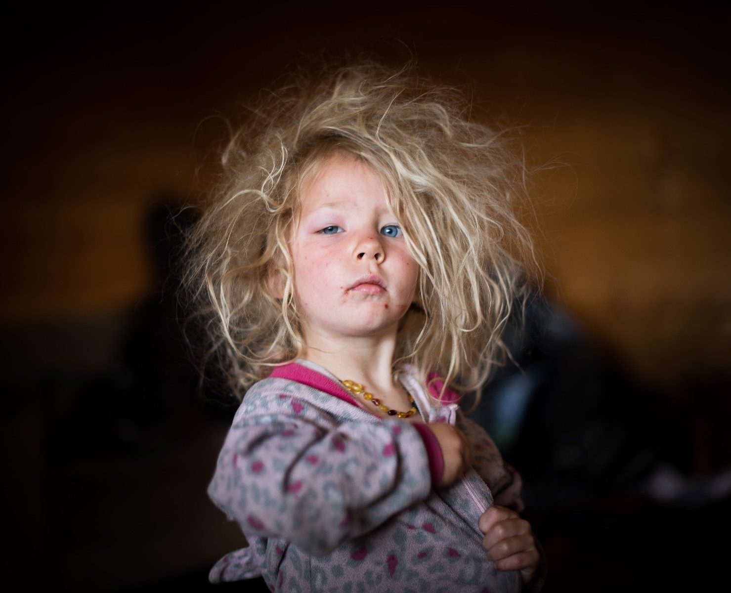 Child, clothes, necklace. Portrait photograph by Jade Dumas, finalist in the Shoot The Frame Portrait photography award, February 2018