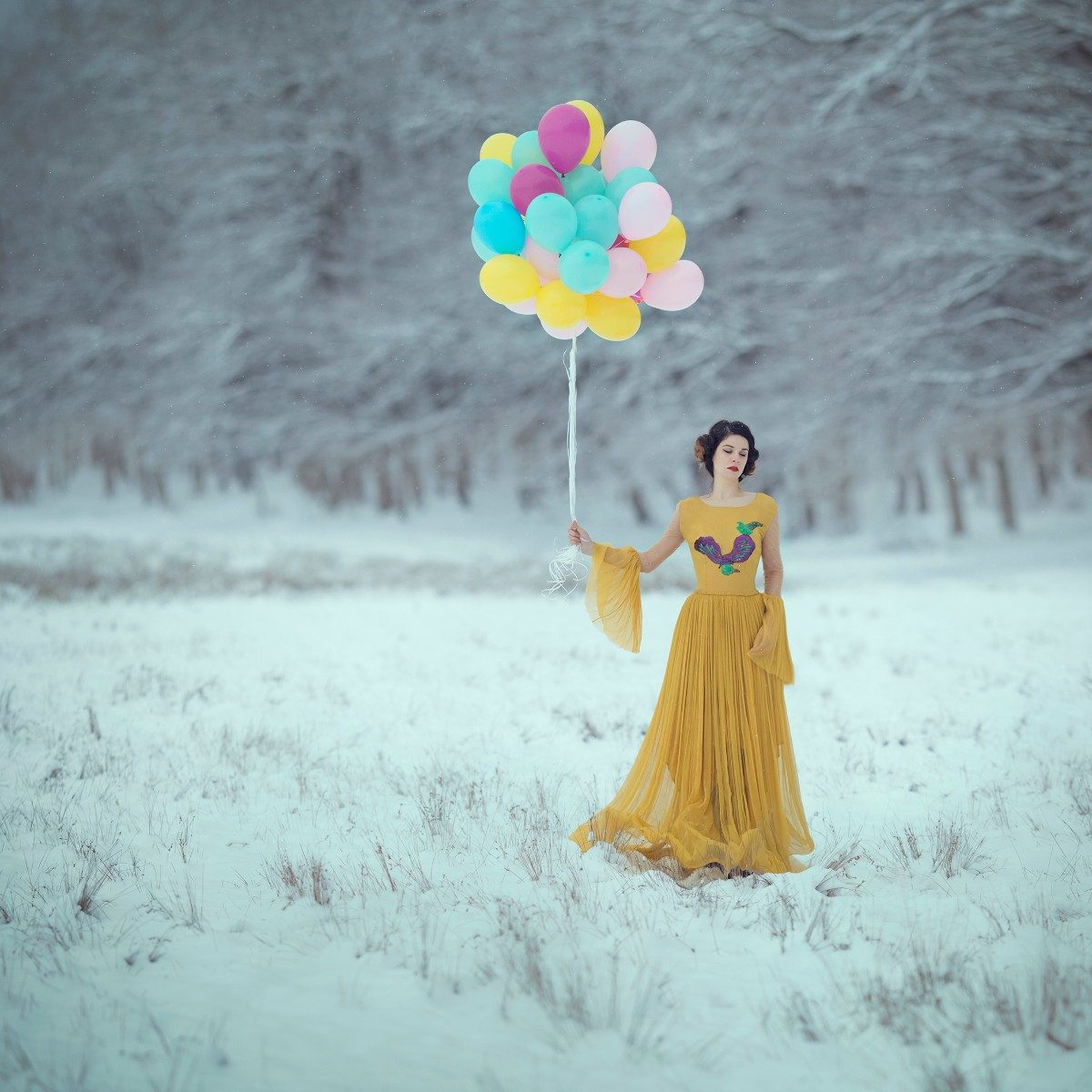 Human, balloons, grass. Portrait photograph by Raluca Arhire, winner of the Shoot The Frame Portrait photography award, February 2018