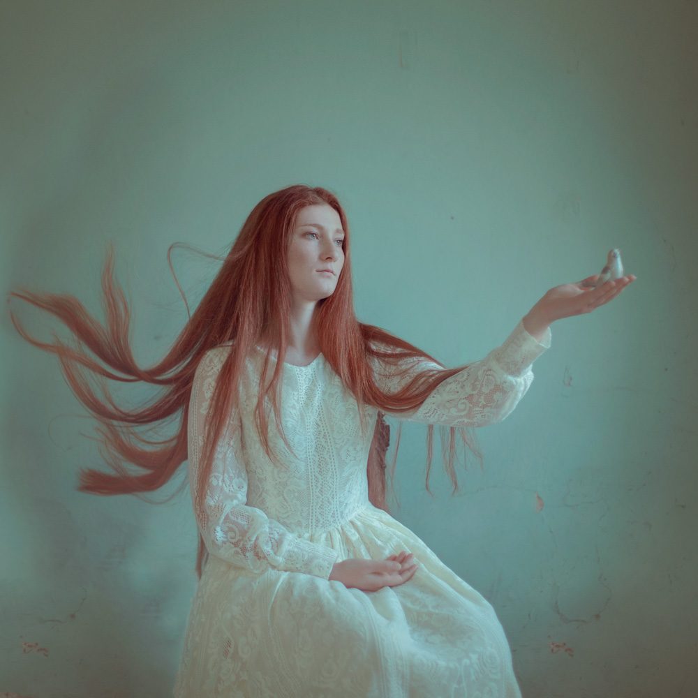 Bird, dress, hair, lady. Portrait photograph by Raluca Arhire, finalist in the Shoot The Frame Portrait photography award, May 2018