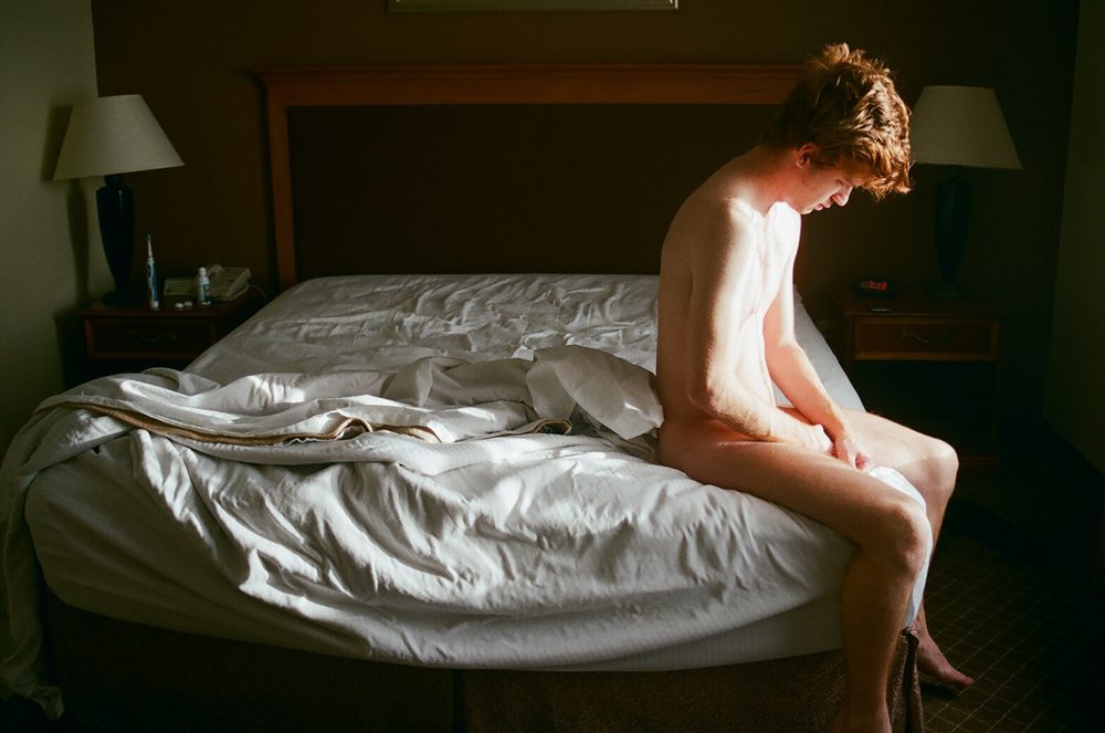 Lamp shade, bed, blanket. Portrait photograph by Andrea Alonso, finalist in the Shoot The Frame Portrait photography award, June 2018