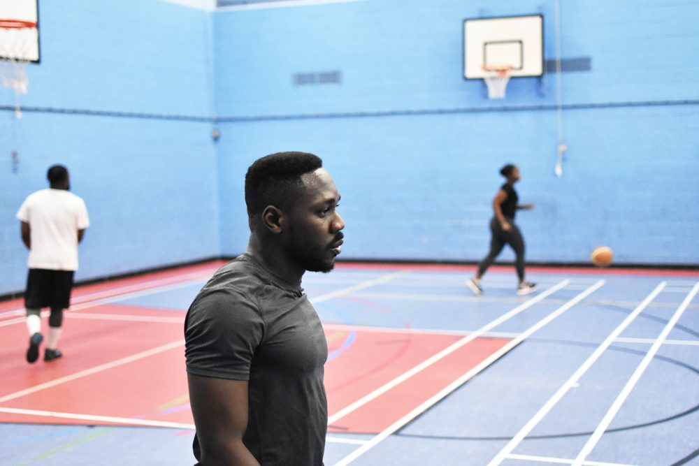 Ball, human, basketball court. Portrait photograph by Sophia Rooke, finalist in the Shoot The Frame Portrait photography award, June 2018