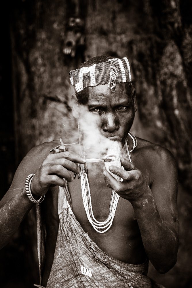 Smoke, bracelet, necklace. Portrait photograph by Guy Needham, finalist in the Shoot The Frame Portrait photography award, September 2018