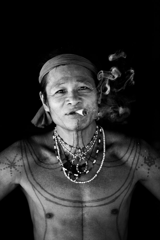 Human, necklace, cigarette. Portrait photograph by Guy Needham, finalist in the Shoot The Frame Portrait photography award, October 2018