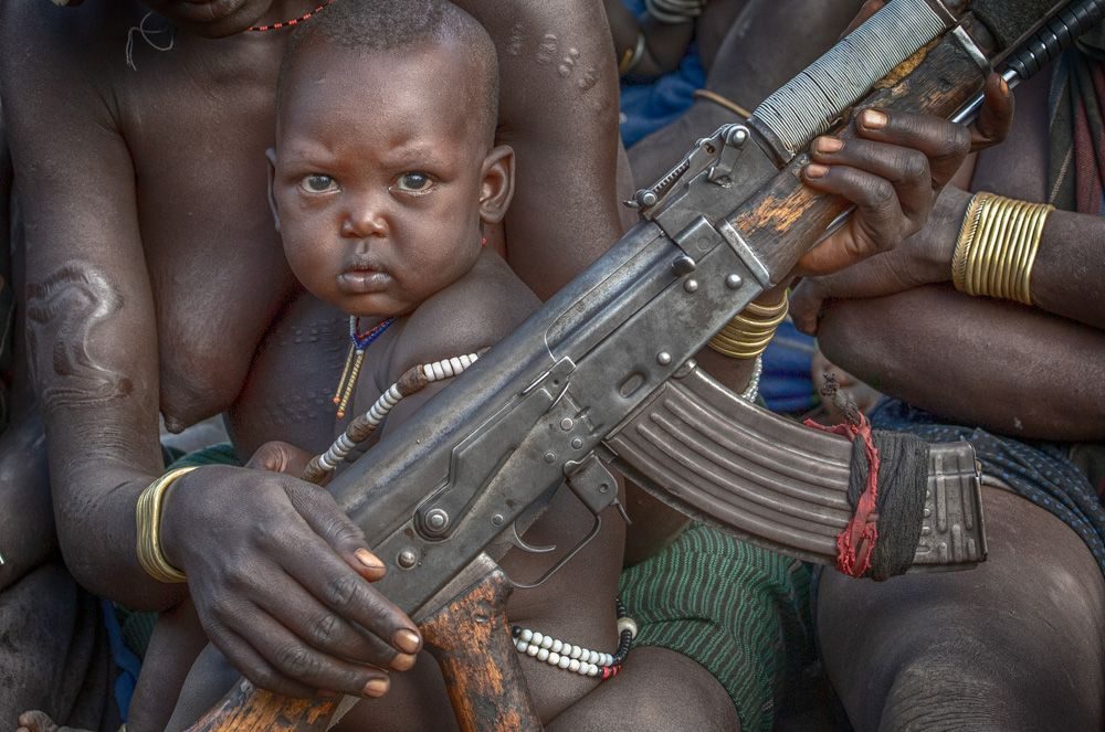 Gun, bracelet, human. Portrait photograph by ChanOnn Fong, finalist in the Shoot The Frame Portrait photography award, November 2018