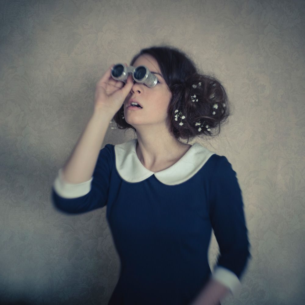 Binoculars, dress, woman. Portrait photograph by Raluca Arhire, finalist in the Shoot The Frame Portrait photography award, November 2018