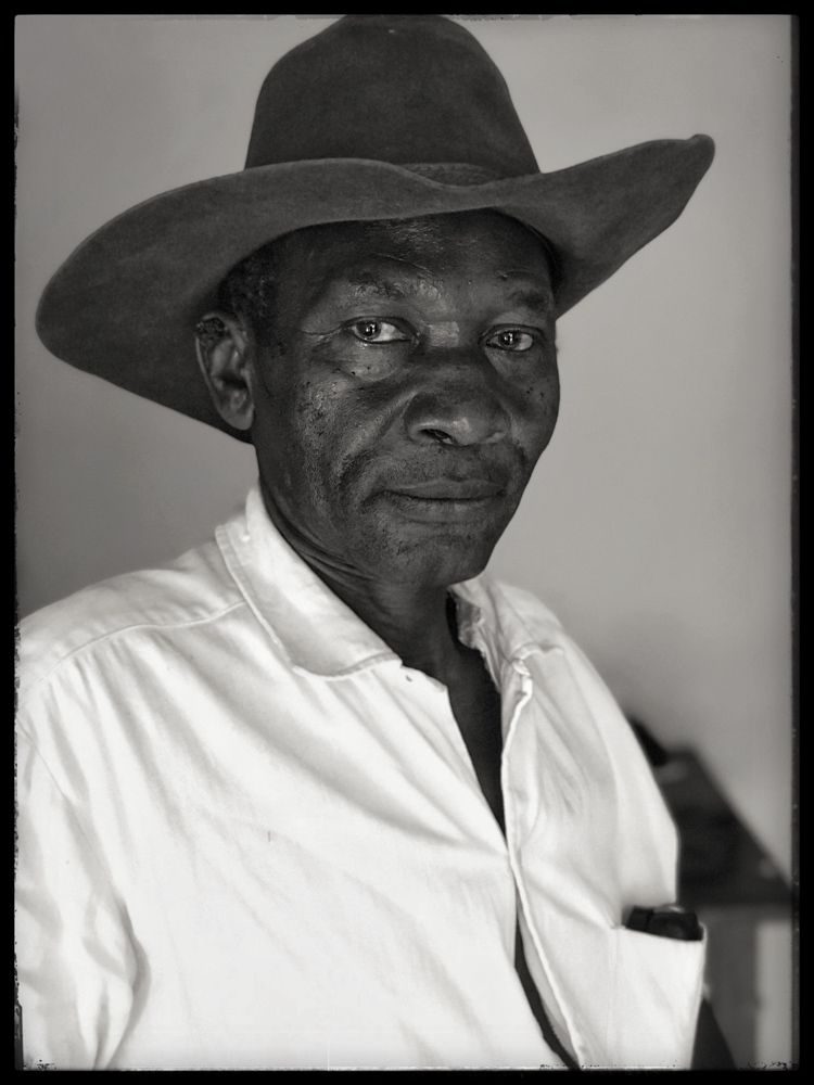 Cap, clothes, human. Portrait photograph by Barry Mayes, finalist in the Shoot The Frame Portrait photography award, December 2018