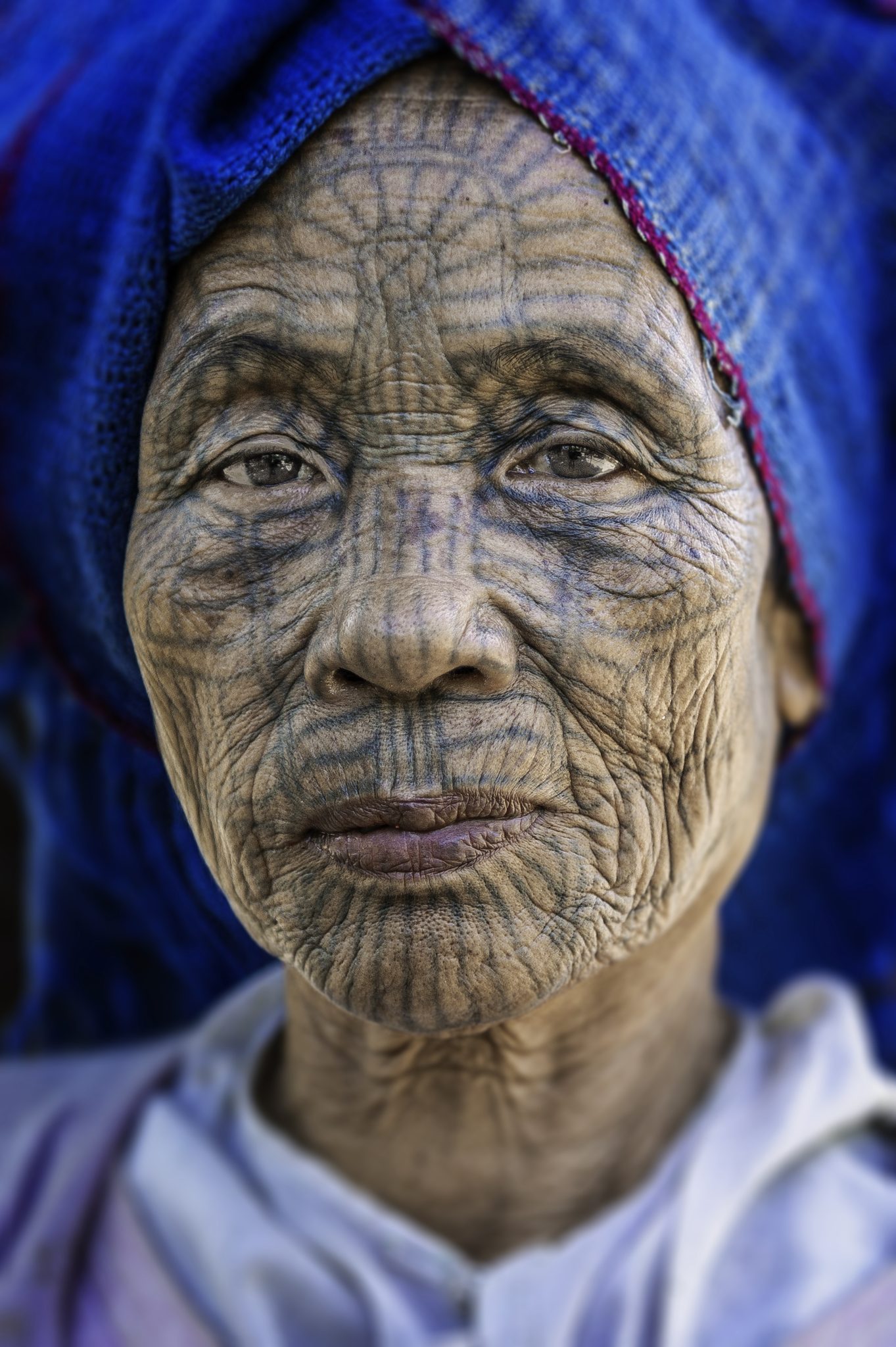 A Story Written on Skin, Chin State, Myanmar (Burma). Portrait photograph by John Quintero, winner of the Shoot The Frame Portrait photography award, March 2020