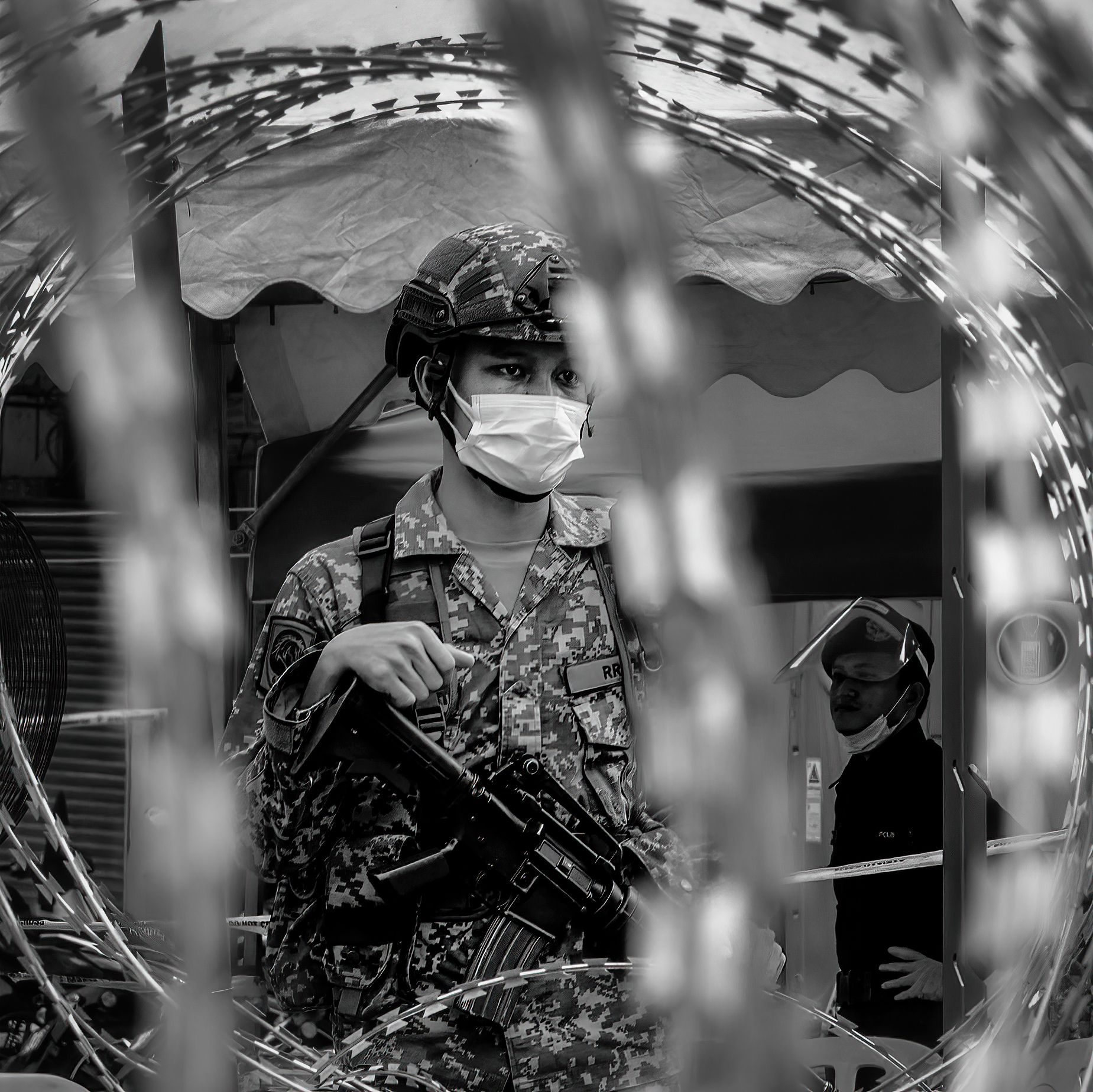 Fighting the invisible foe. Portrait photograph by ChanOnn Fong, finalist in the Shoot The Frame Portrait photography award, August 2020