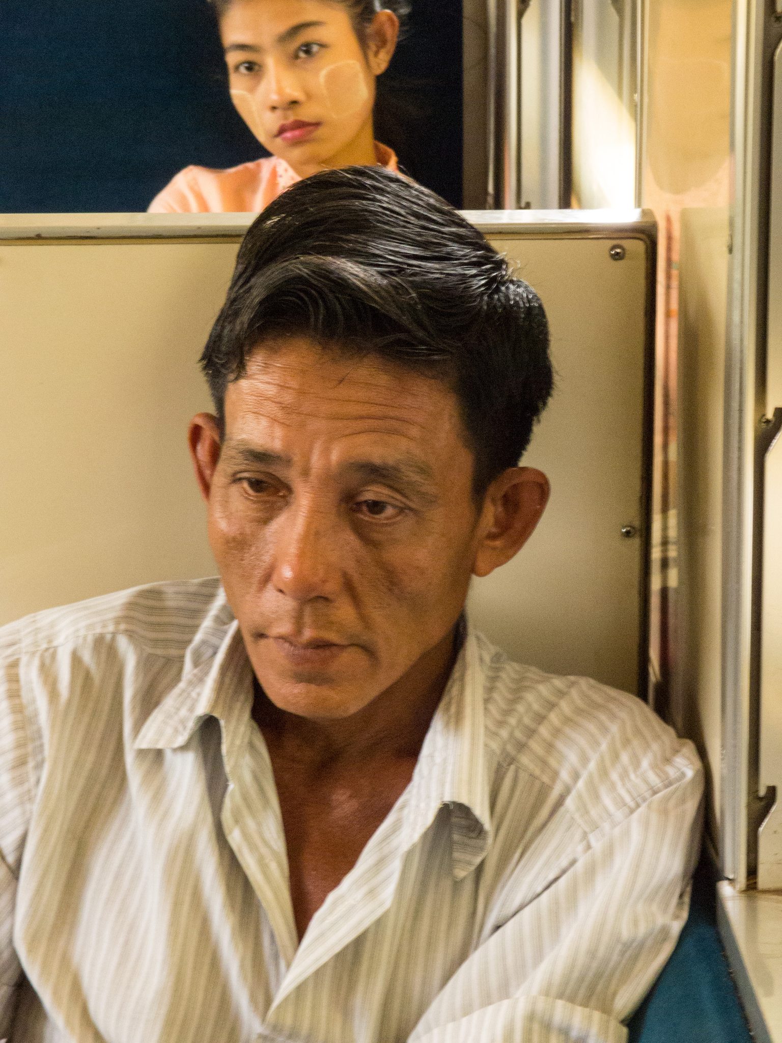 Commuters, Yangon, Yangon, Myanmar. Portrait photograph by Ron Hershey, finalist in the Shoot The Frame Portrait photography award, May 2021