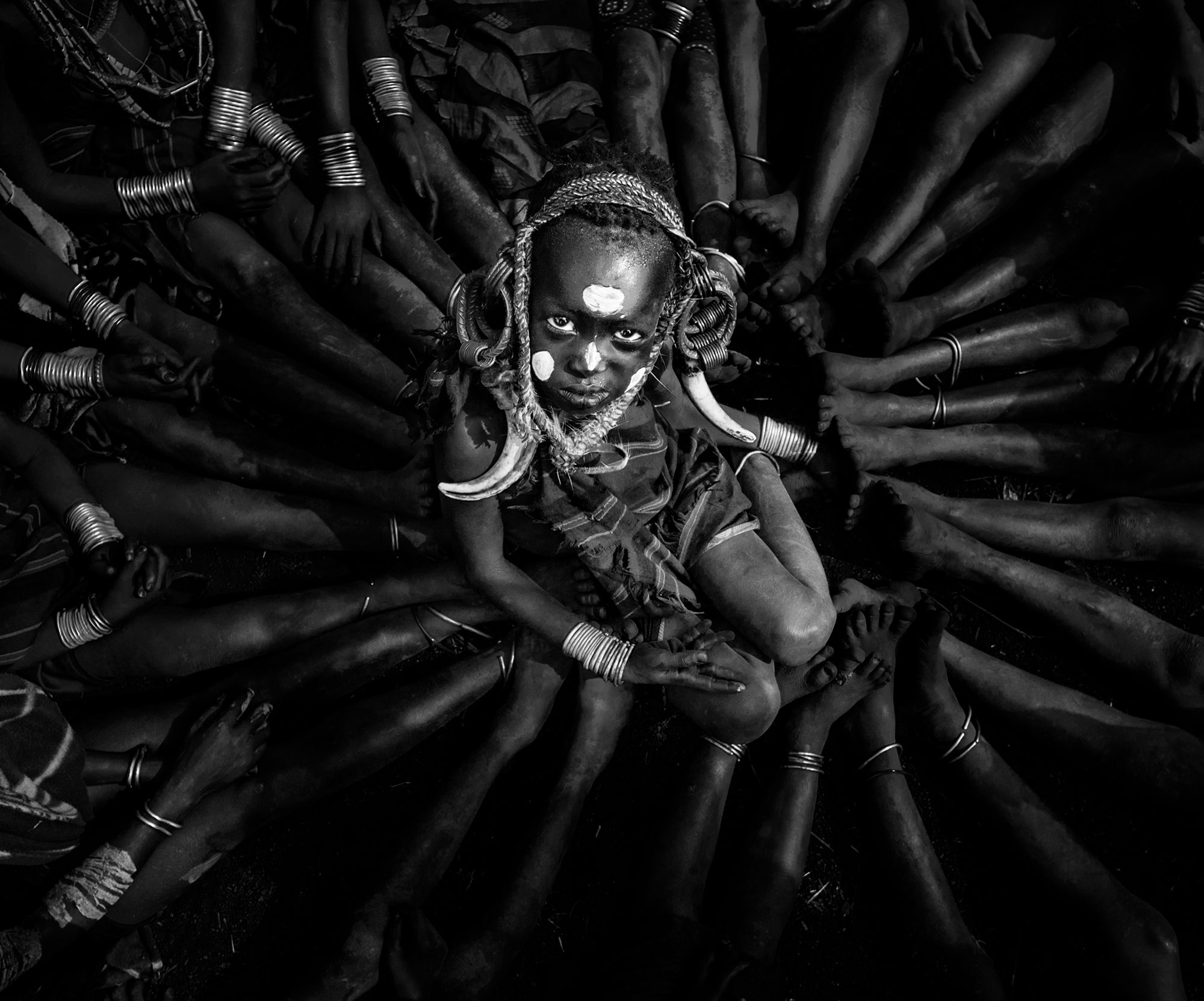 Mursi Boy among Friends, South Ethiopia. Portrait photograph by ChanOnn Fong, finalist in the Shoot The Frame Portrait photography award, July 2021