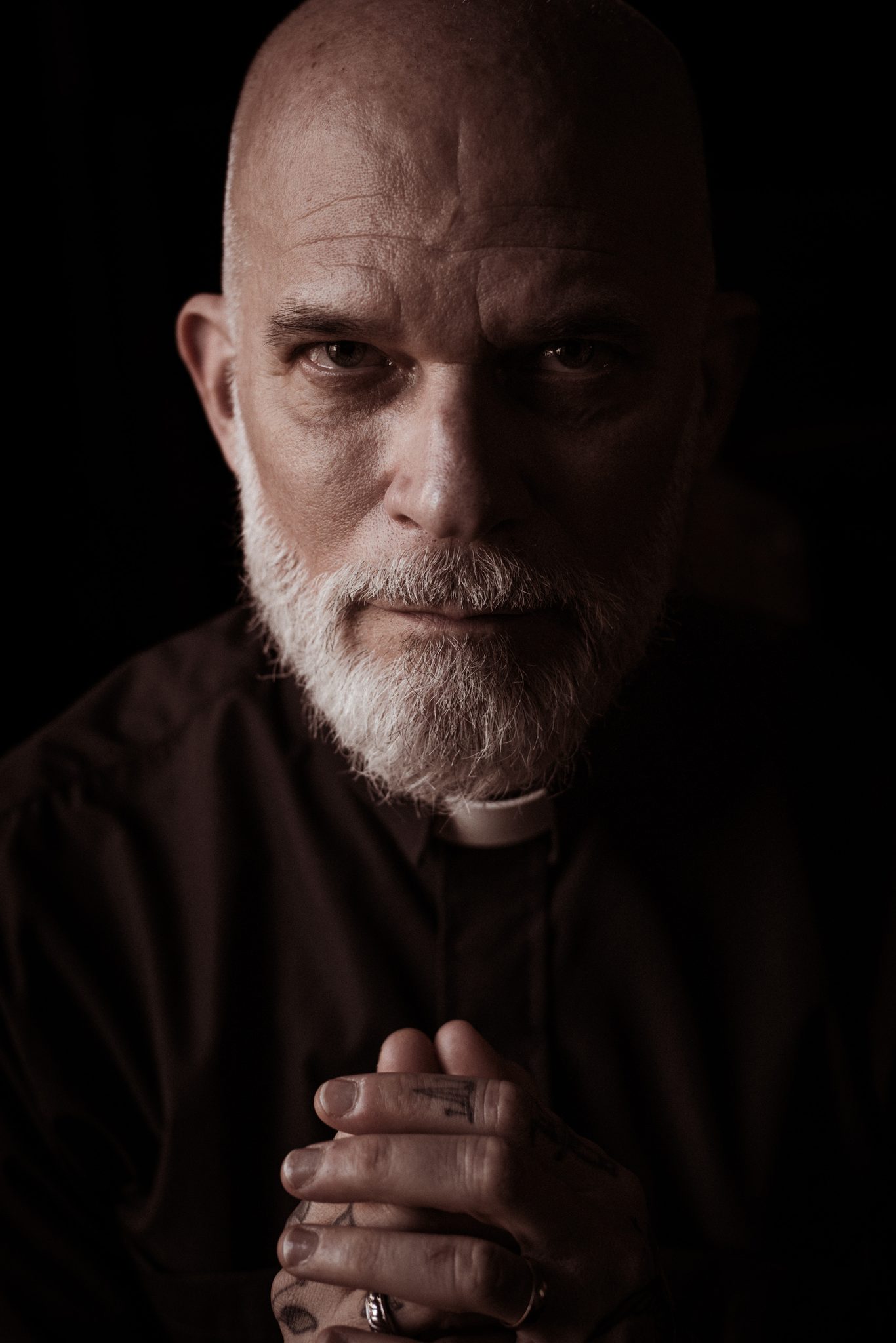 The tattooed priest, New York, NY, USA. Portrait photograph by Argun Tekant, finalist in the Shoot The Frame Portrait photography award, March 2023