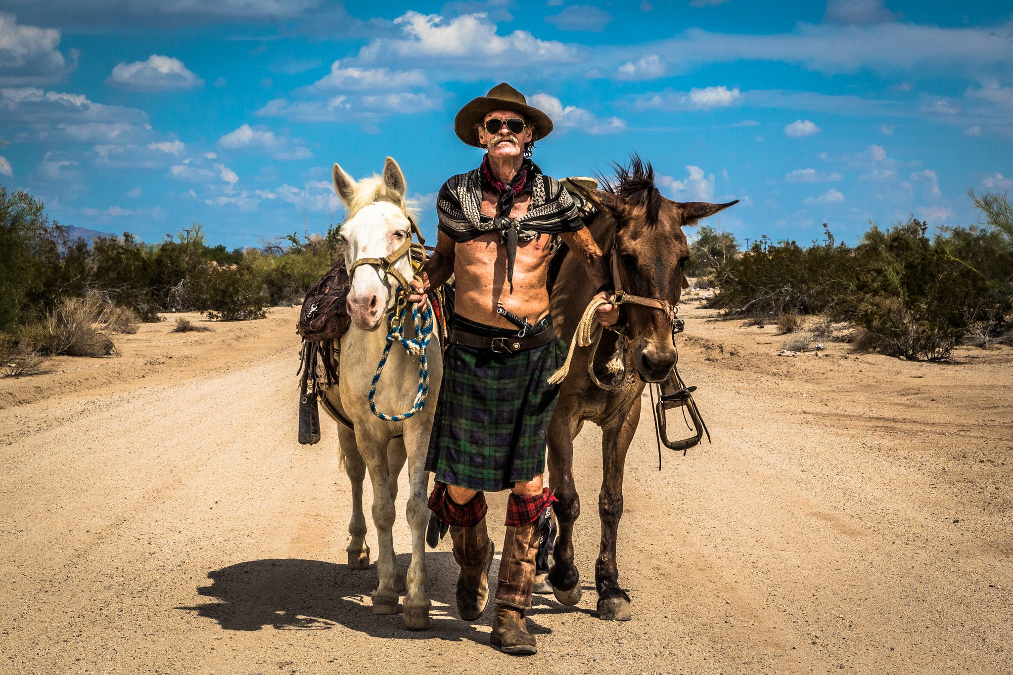 The Wind Chasers, Slab City, CA 92233, USA. Portrait photograph by Dmitrii Demchenko, finalist in the Shoot The Frame Portrait photography award, November 2023