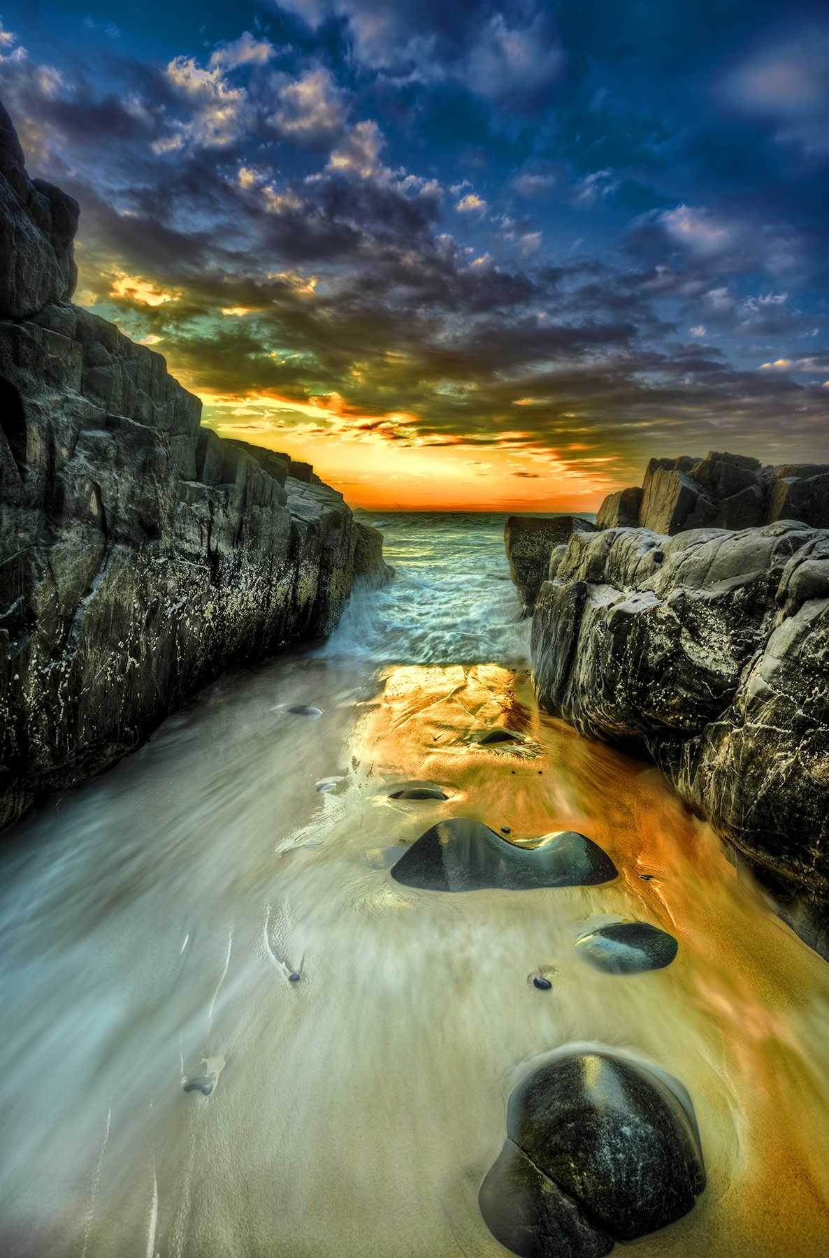 Water, shore, stones, sky. Landscape photograph by James Smart, finalist in the Shoot The Frame Landscape photography award, May 2014