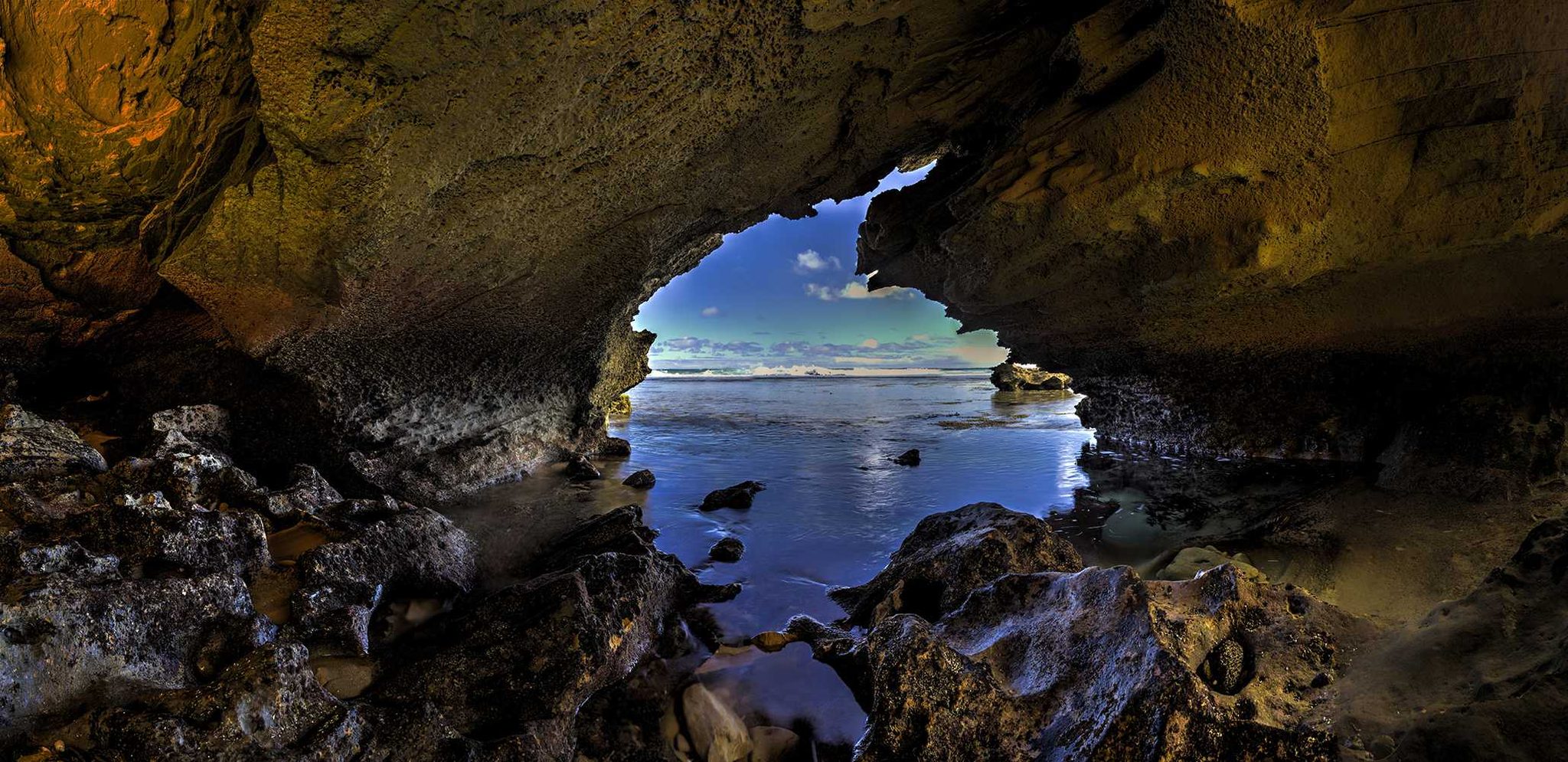 Cave, hills, water, ocean. Landscape photograph by James Smart, finalist in the Shoot The Frame Landscape photography award, October 2014